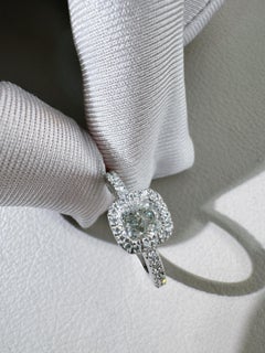 De Beers 1 Carat Cushion-Cut Platinum Diamond Ring with Luxurious Halo Setting