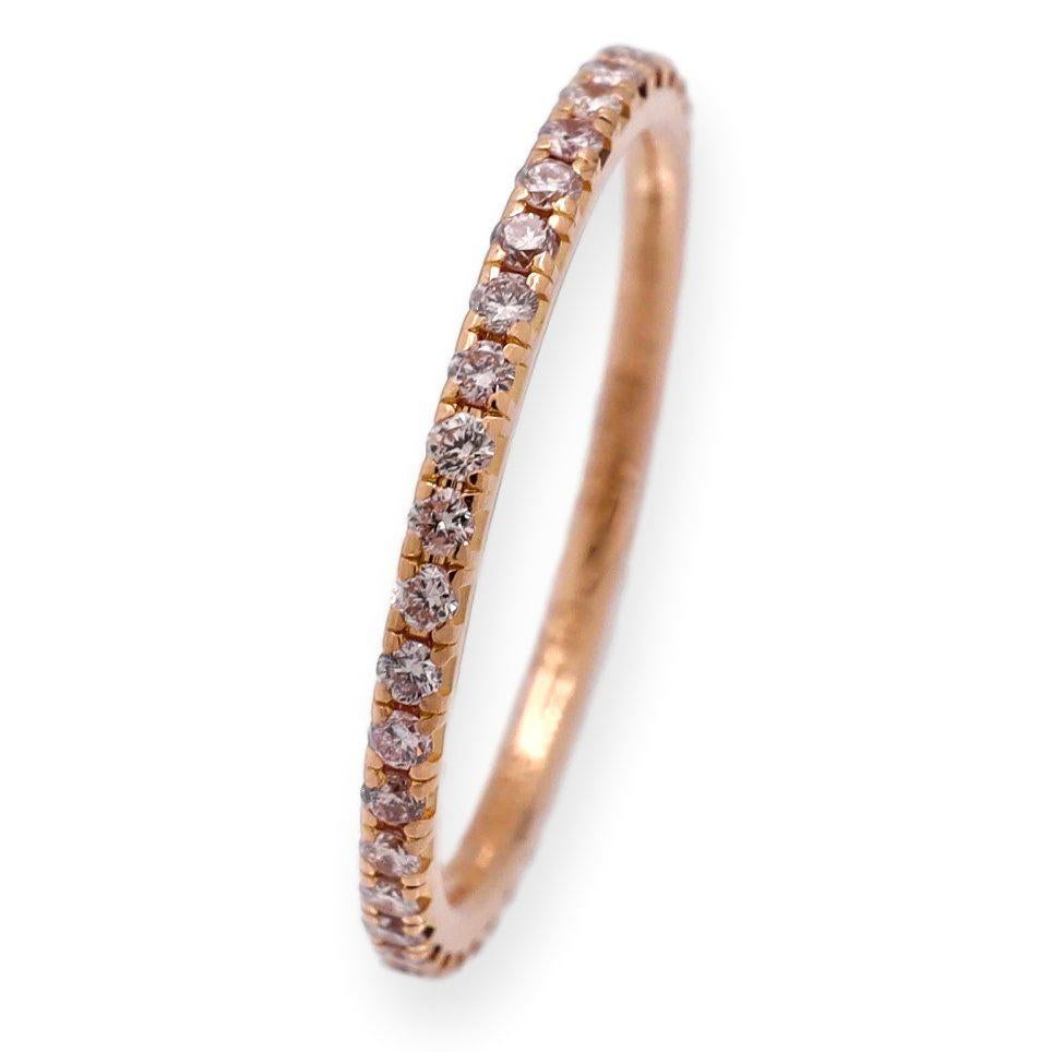 DeBeers AURA Collection Band Ring. Meticulously crafted in 18k rose gold, this ring showcases 41 Fancy Pink round brilliant cut diamonds, totaling 0.37 carats. With Vs clarity, these diamonds create an exquisite sparkle that enchants the eye. The