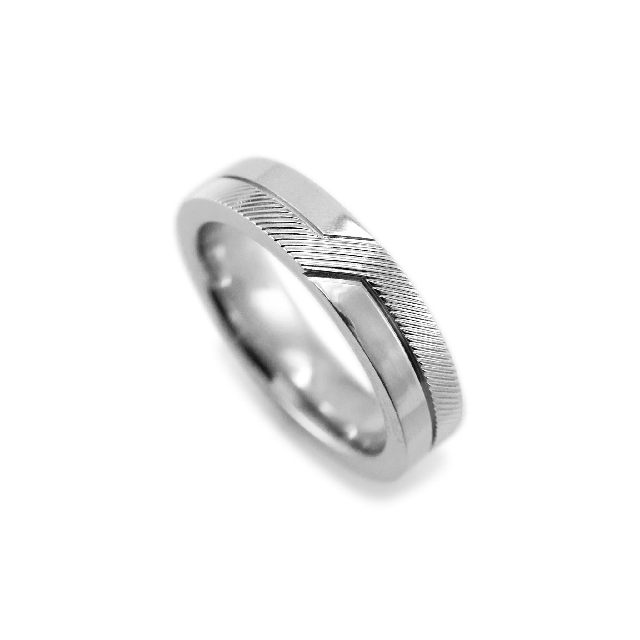 Brand: De Beers

Gender: Ladies

Metal Type: 18K White Gold 

Ring Size: 7.5

Width: 5.00 mm

Weight: 10.50 grams

18K White Gold diamond wedding band with a comfort-fit shank. The metal was tested and determined to be 18K white gold. Engraved with