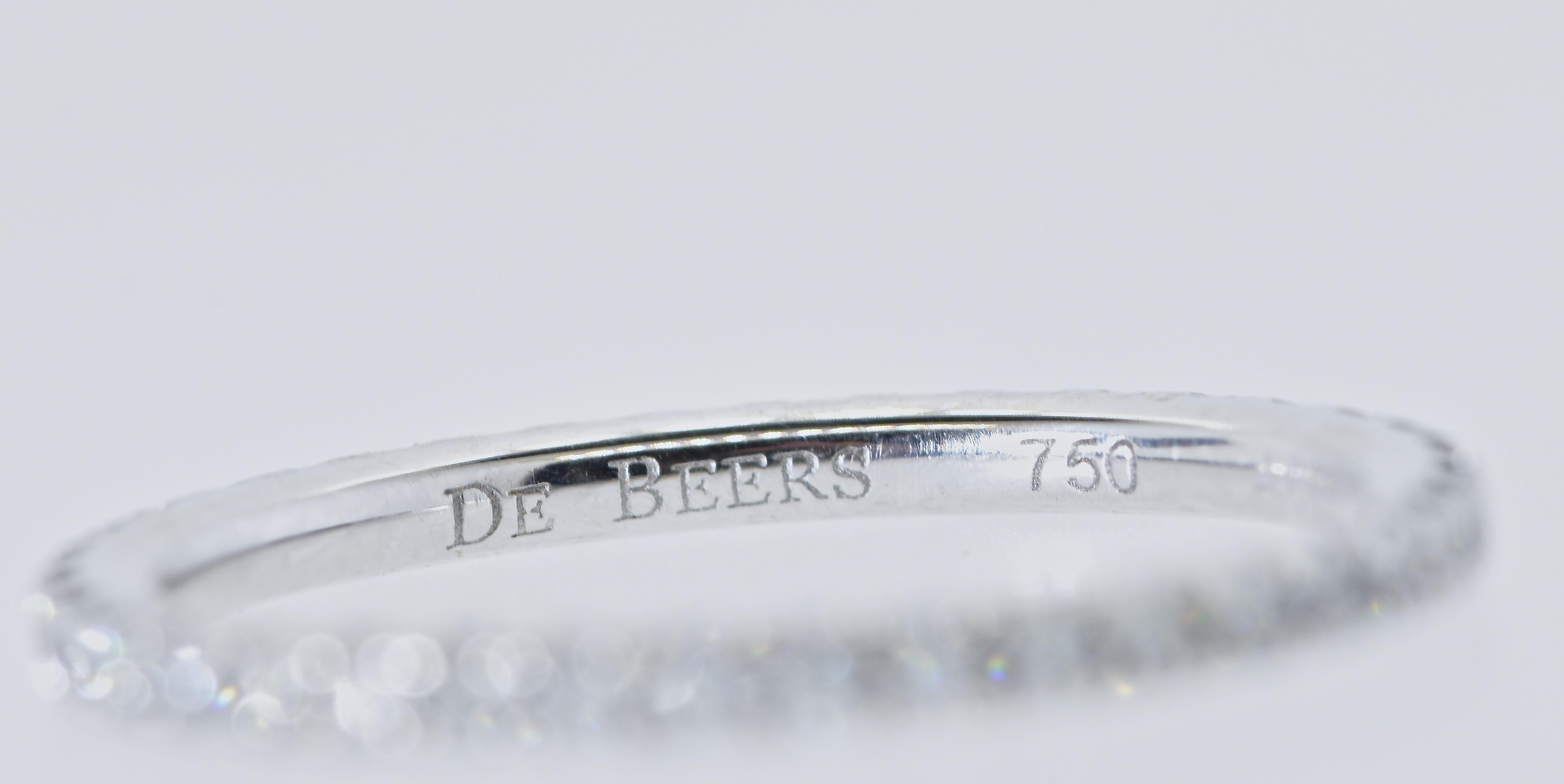 De Beers diamond and 18K white gold eternity band.  The 38 bead set round brilliant cut diamonds are all colorless to near colorless (F/G), and very very slightly included and weighing .33 cts.  This 18K white gold ring is well made and a classic