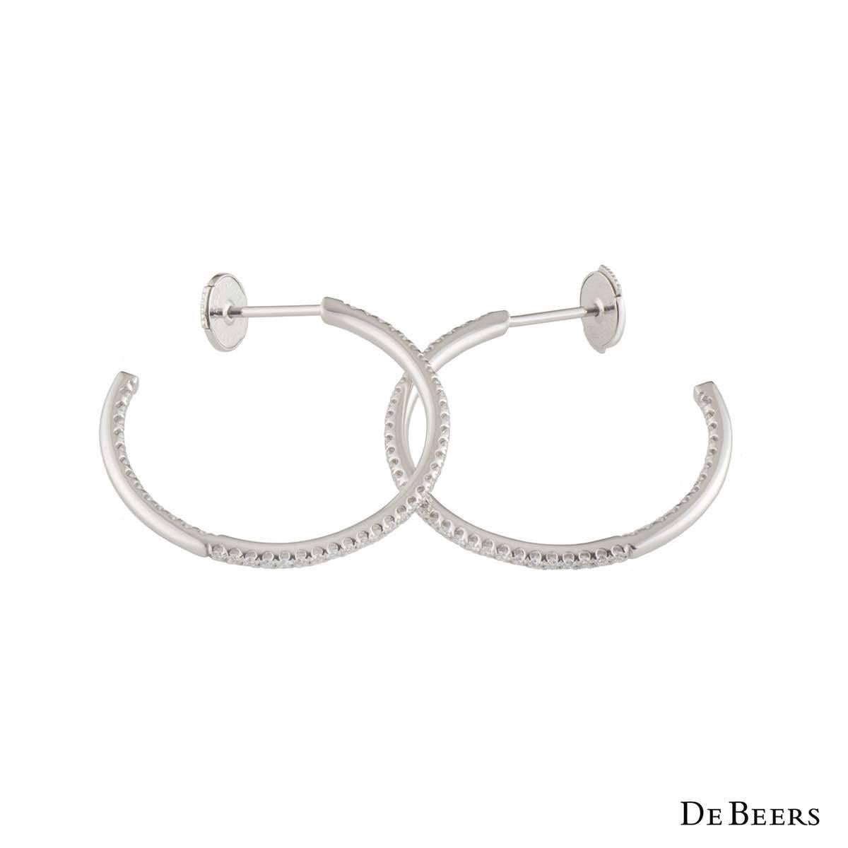A beautiful pair of 18k white gold diamond De Beers hoop earrings from the Micropave Classics collection. The earrings each comprise of round brilliant cut diamonds in a micro pave setting with a total weight of approximately 0.54ct G+ colour and