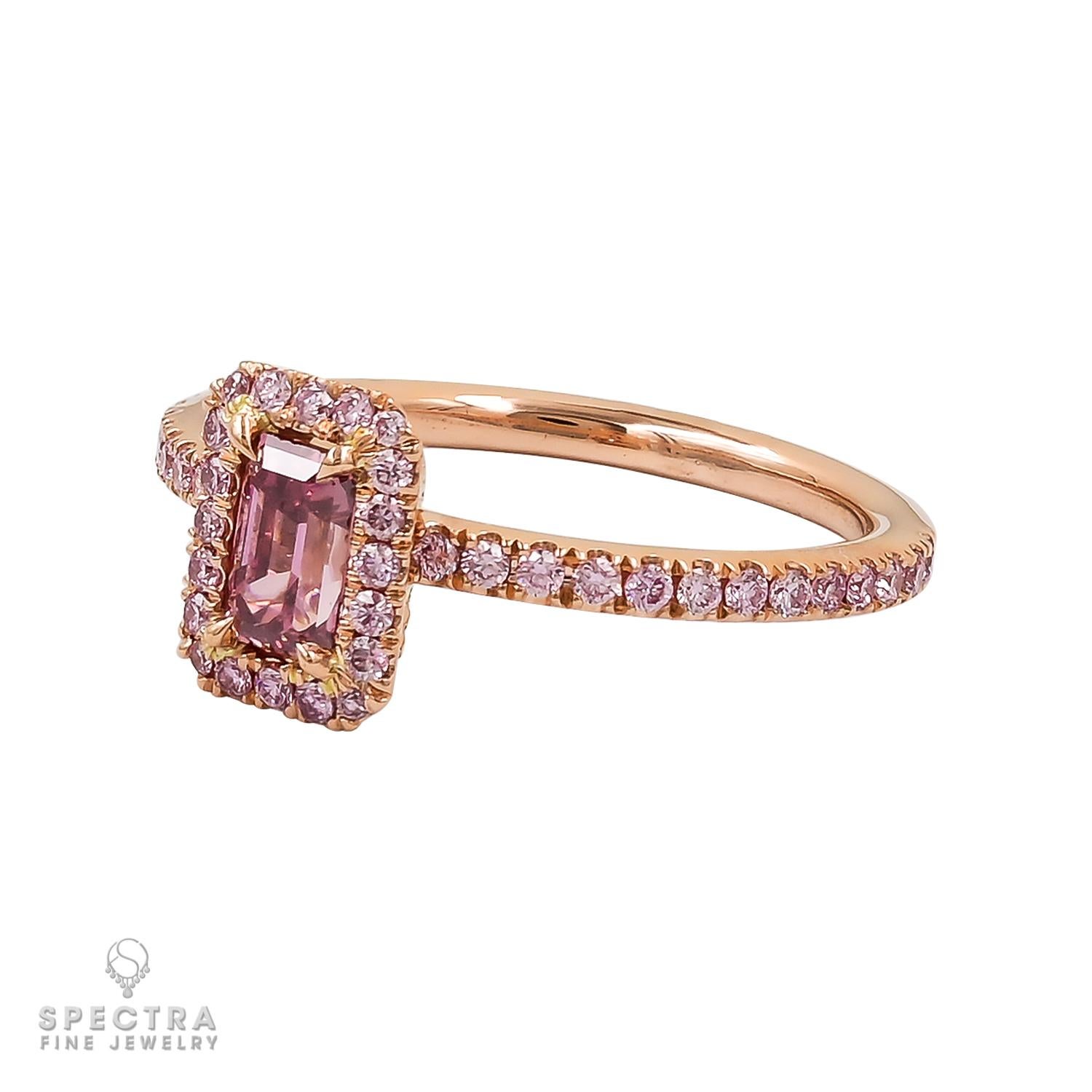 Introducing a tale of love woven into every glimmer! Behold the sublime emblem of eternal love – the enchanting engagement ring crafted by De Beers!
At the core of this masterpiece resides a 0.44-carat fancy vivid pink diamond, effusing the fervor