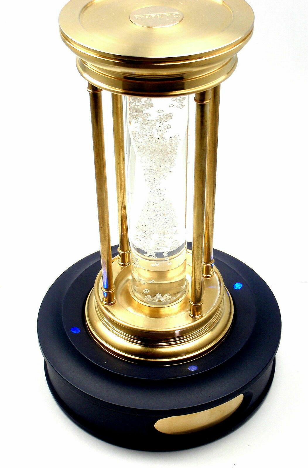 Very Rare! Limited Edition Millennium 2000 Diamond Brass Hourglass Timer by De Beers.
This item comes with lighted pedestal and box.
This hourglass was just sold on June 3, 2015 at Christies for $41,285.
Containing a cascade of over 2000 natural
