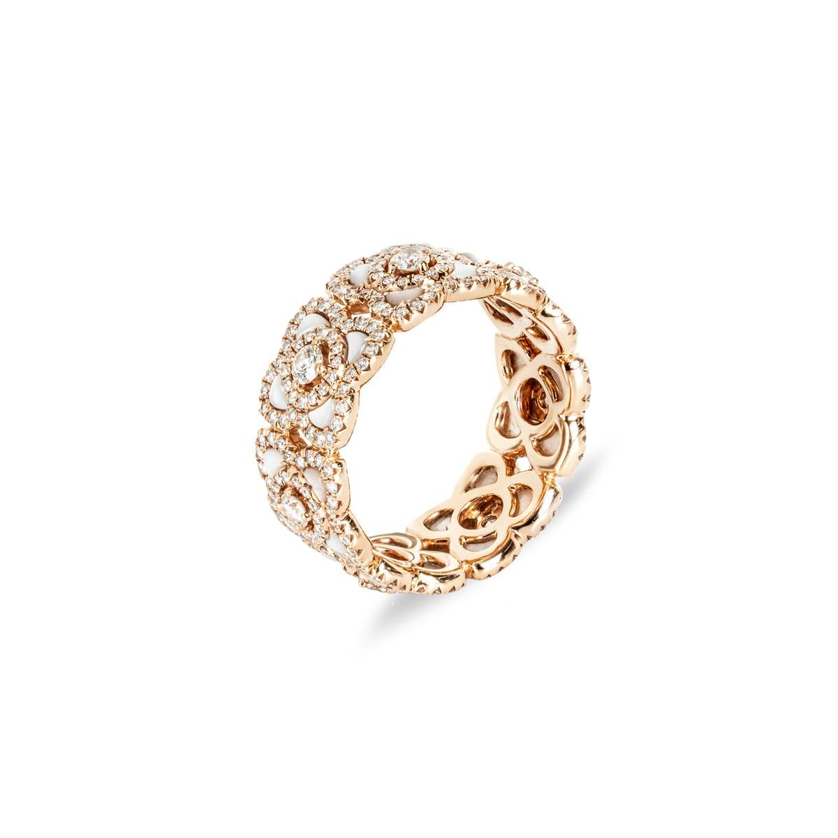 An elegant 18k rose gold diamond ring by De Beers from the Enchanted Lotus collection. The band is set with 7 lotus motifs with mother of pearl inlays, pave set throughout with 301 round brilliant cut diamonds with an approximate total weight of