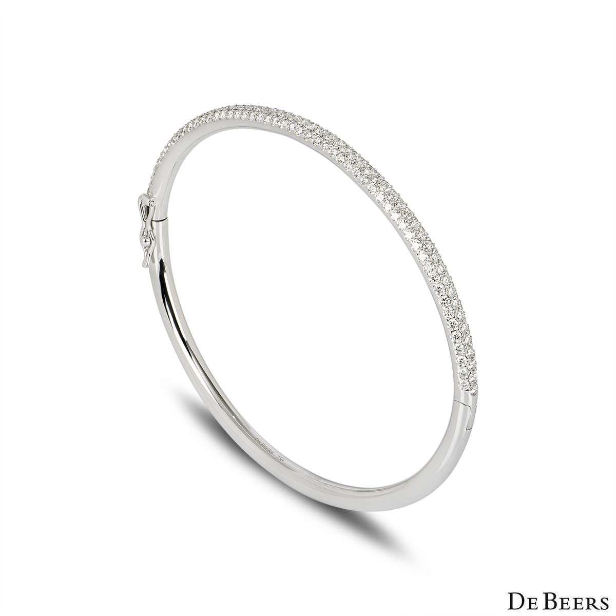 An elegant 18k white gold diamond bangle by De Beers from the Classics collection. The bangle features 162 micropave set round brilliant cut diamonds totalling 2.03ct, predominately F-G colour and VS+ clarity. The bangle fits a wrist up to 16cm,