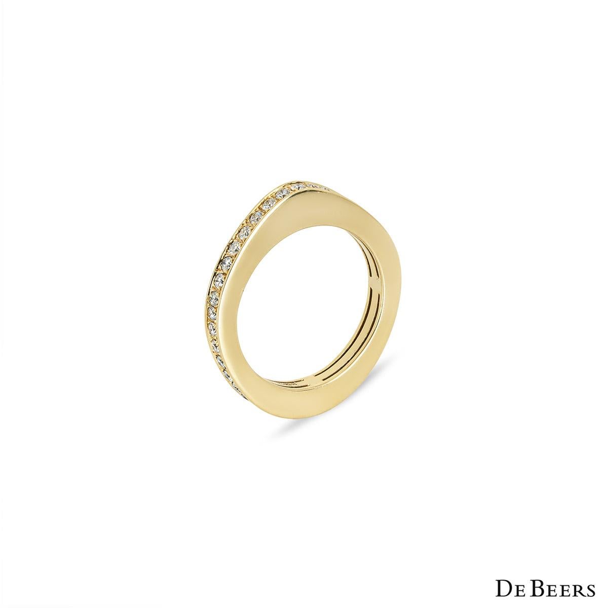 A unique 18k yellow gold diamond full eternity ring by De Beers. The eternity ring is set with 39 round brilliant cut diamonds with an approximate total weight of 0.78ct, F-G colour and VS clarity. The 2.87mm wide ring is a size UK N - EU 53 and has