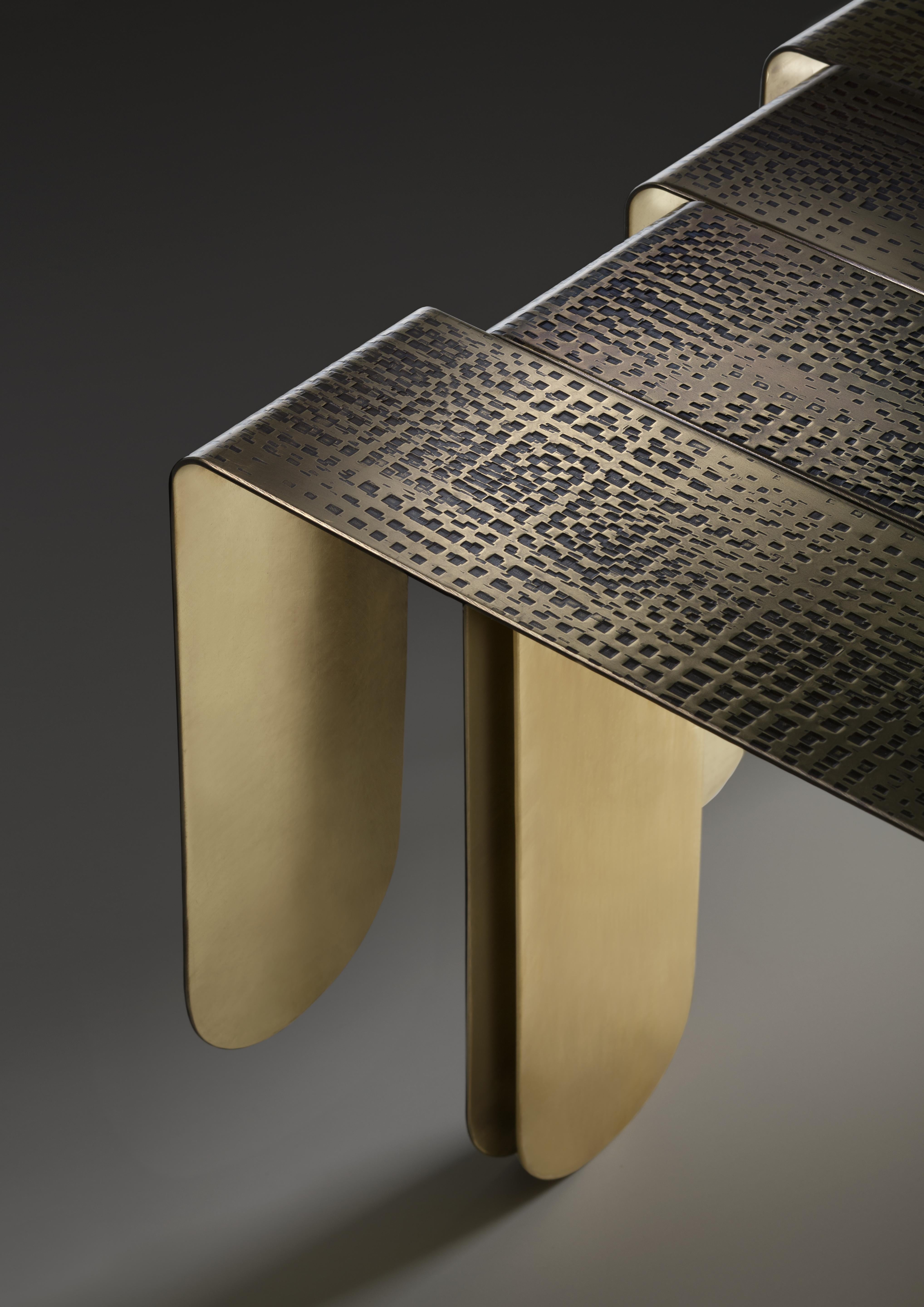 Inspired by the refined, sinuous aesthetics of Art Nouveau, the Xilo coffee tablei is a veritable sculpture
in metal that exalts the hand-crafted techniques and manufacturing excellence of the company.
Three sheets of thick brass, rounded at the