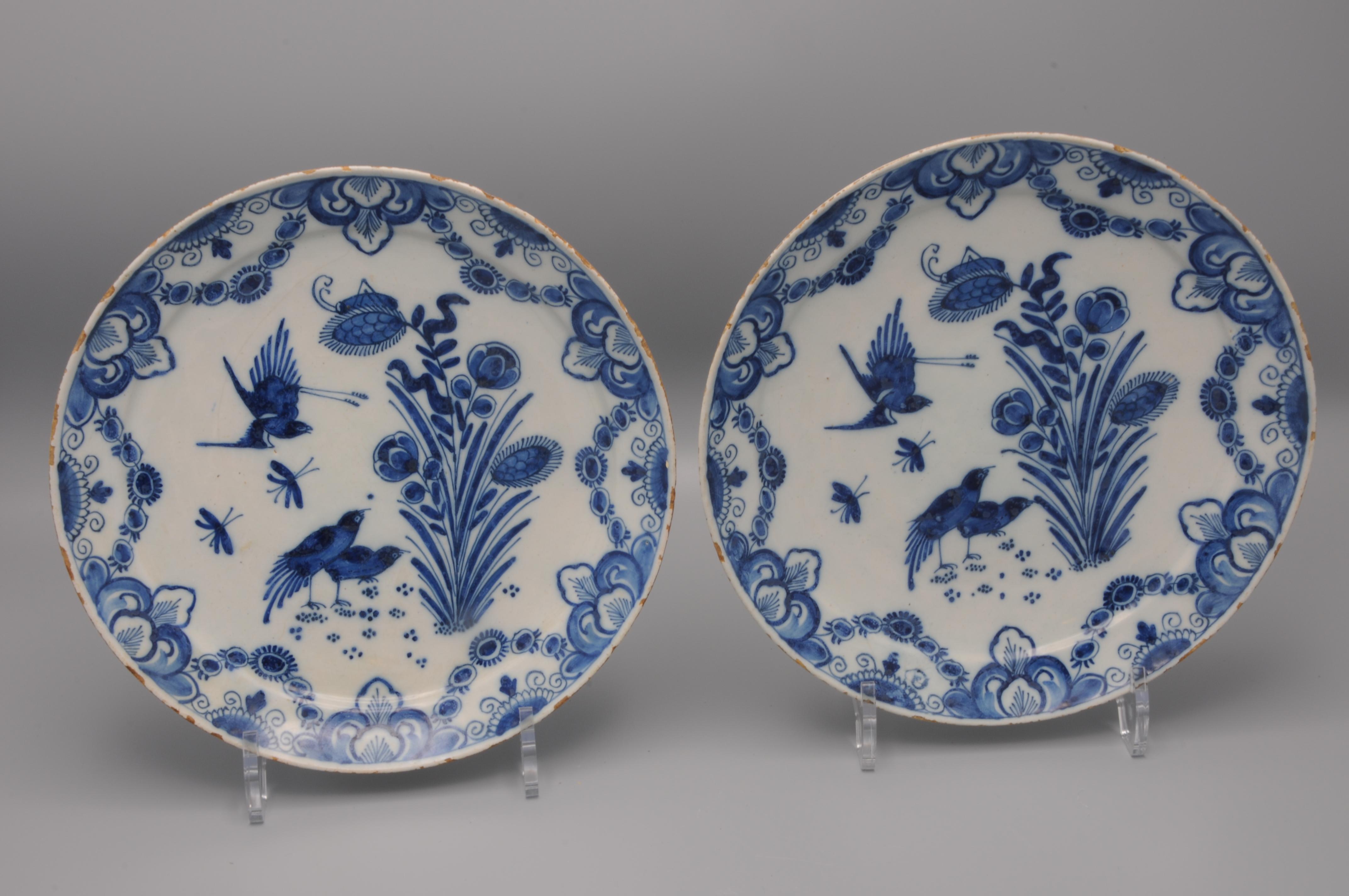 Excellent pair of mid 18th century Delftware plates with fine decoration of birds, insects and flowers in a chinoiserie style fashion. 
Border adorned with foliage scrolls. 

Marked IVL for Johannes and Margaretha van Lockhorst-van der Gucht, owners