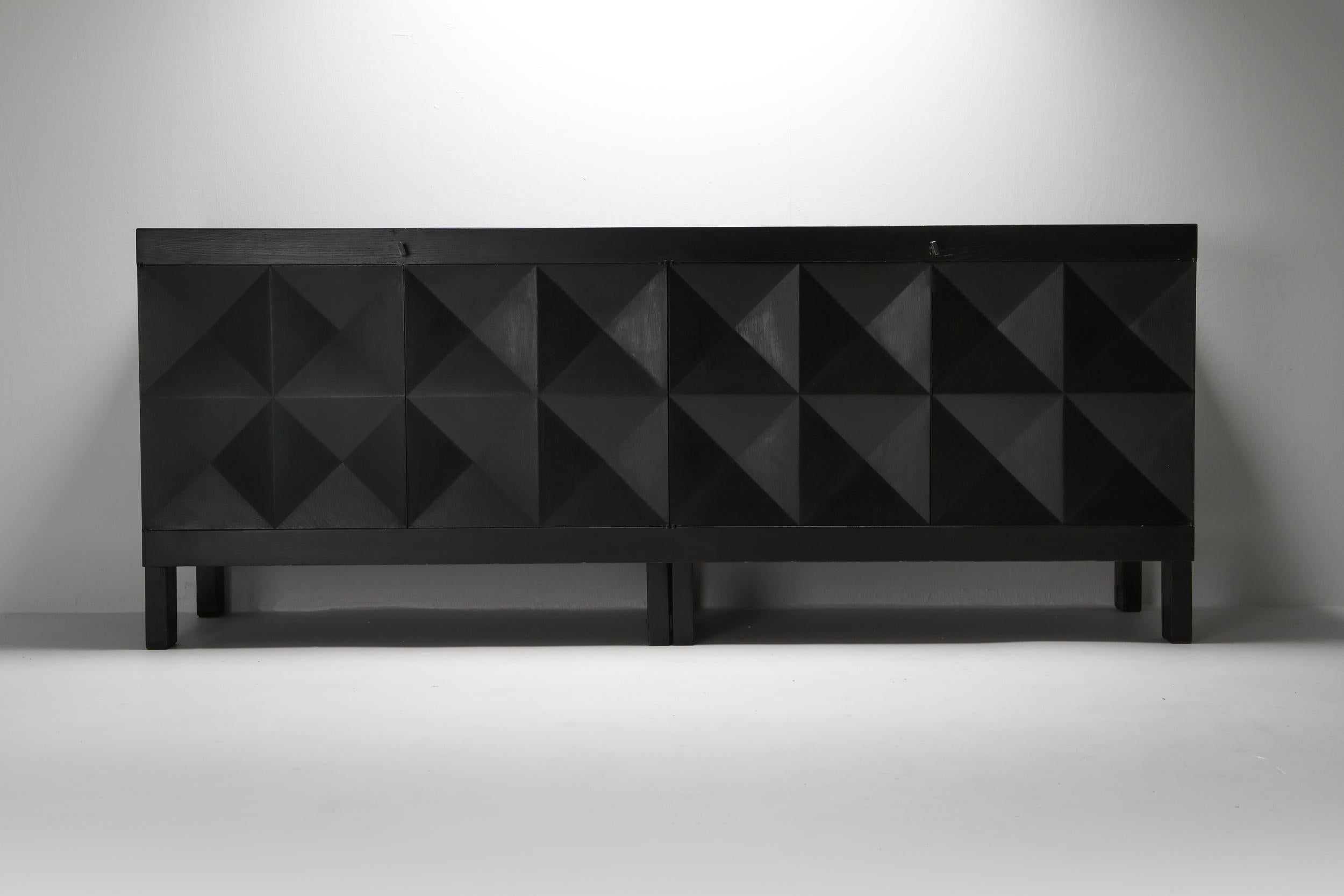 Geometrical credenza, De Coene Belgium, ebonised oak, 1970s

De Coene was founded in 1887 in Kortrijk (Belgium) by Jozef de Coene, who was at that time 13 years old. In 1895 his younger brother Adolphe joined the company. In their early years De