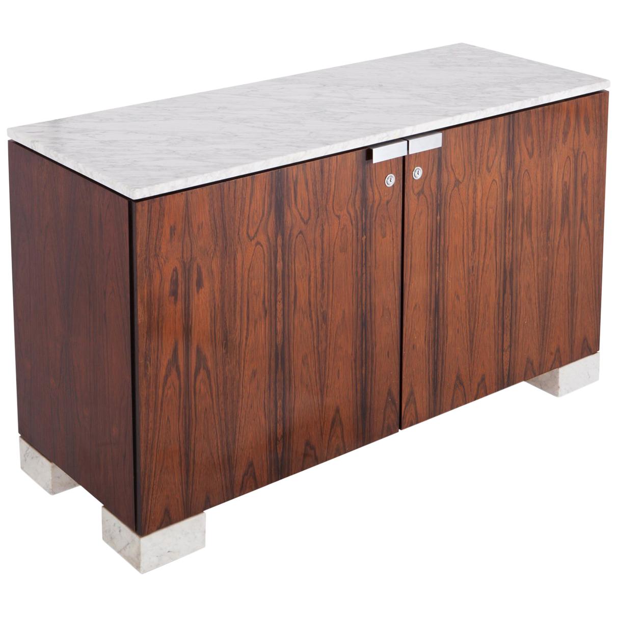 Mid-Century Modern Sideboard in very rich materials such as rosewood and Carrara marble top by De Coene Freres — Belgium, 1960s. 

This high quality cabinet is provided with two doors that are finished with locks and chrome handles that contrast