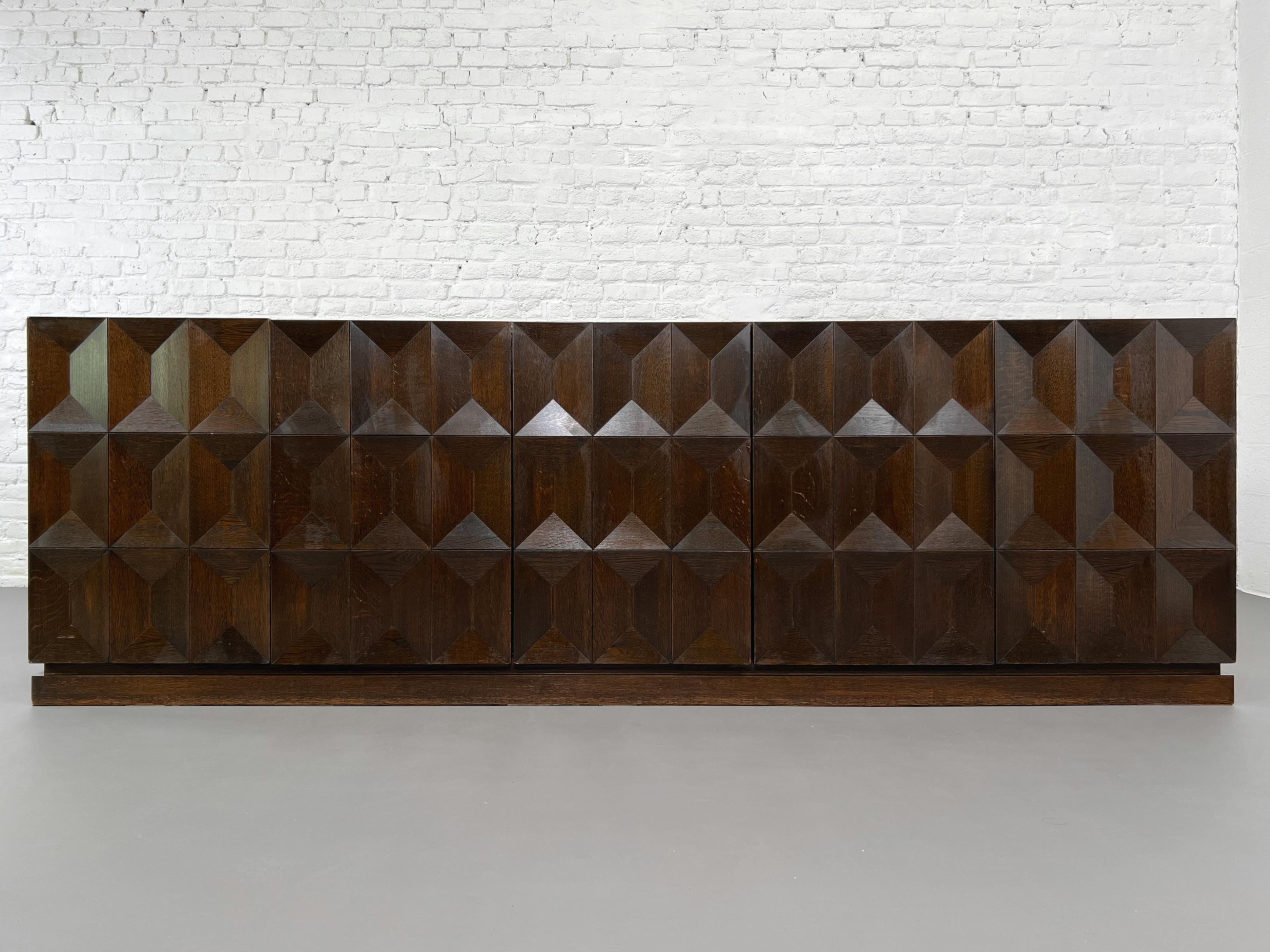 Minimalist And Brutalist Dutch Design sideboard with graphic diamond shaped panels doors, geometric and timeless lines, robustness and high quality crafmanship by the De Coene Brothers.
 