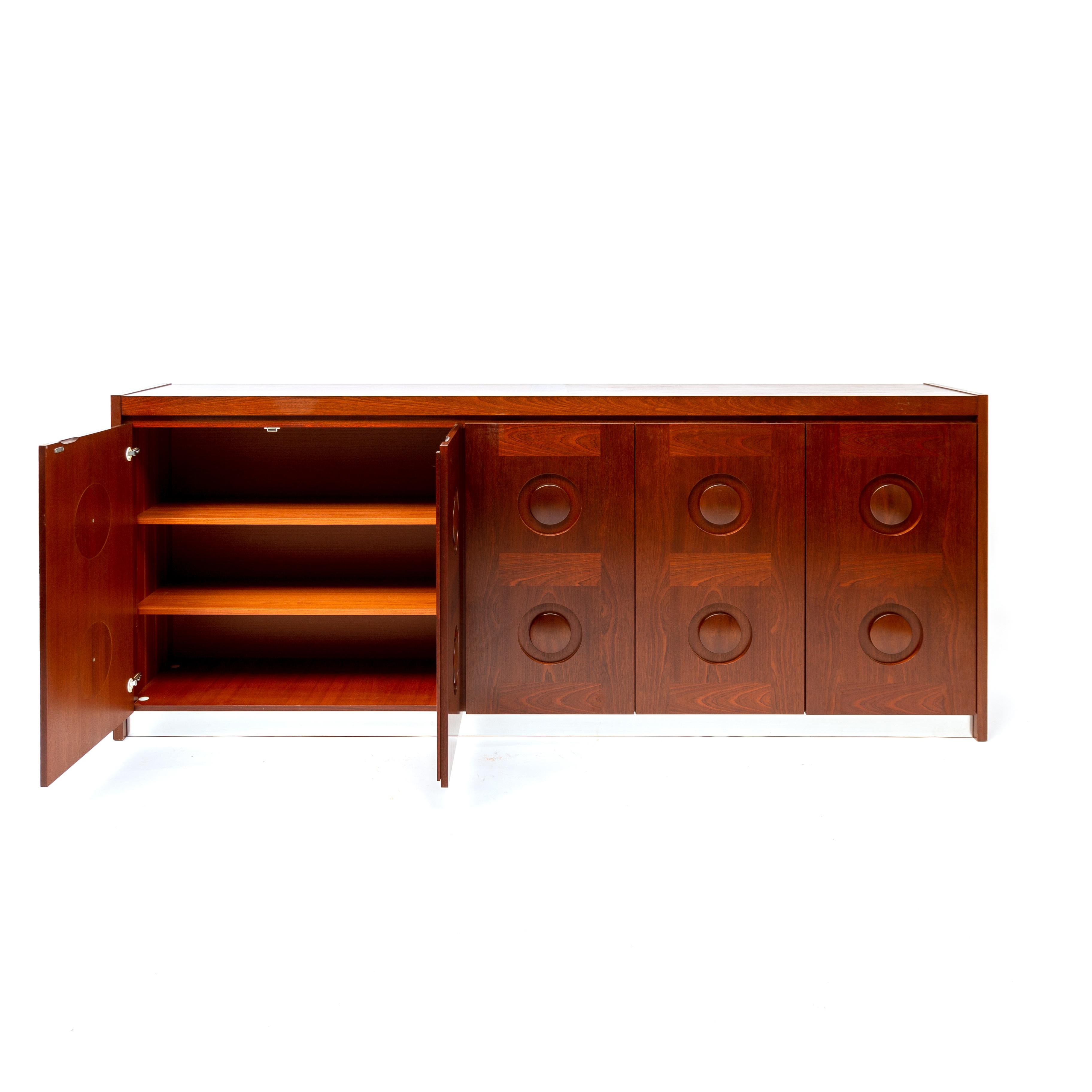 De Coene Jatoba wooden credenza, Belgium, 1970s. Minimalist Mid-Century Modern/Brutalist piece that fits well in an eclectic chic interior. This large sideboard with geometric doors is made in Belgium in the 1970s. The credenza shows a round pattern