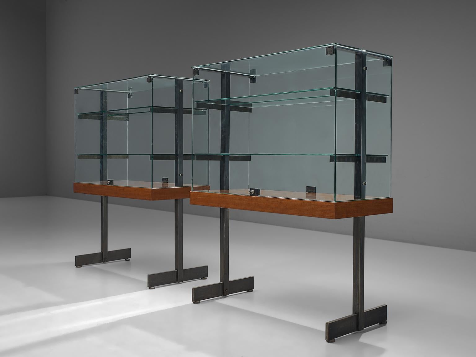 De Coene, large set of vitrines, teak, steel and glass, Belgium, 1960s. 

Modernist showcases with two doors on the side all original glass and in good condition. Accompanied with steel and wood frames. The vitrine features the brutalist and