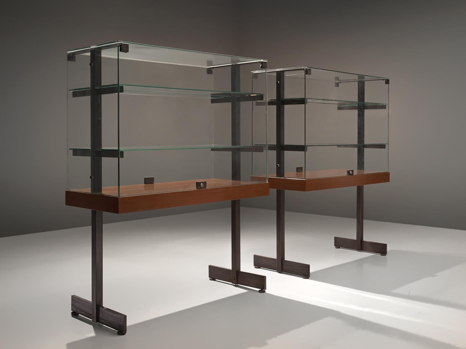 De Coene, large set of vitrines, teak, steel and glass, Belgium, 1960s. 

Modernist showcases with two doors on the side all original glass and in good condition. Accompanied with steel and wood frames. The vitrine features the Brutalist and