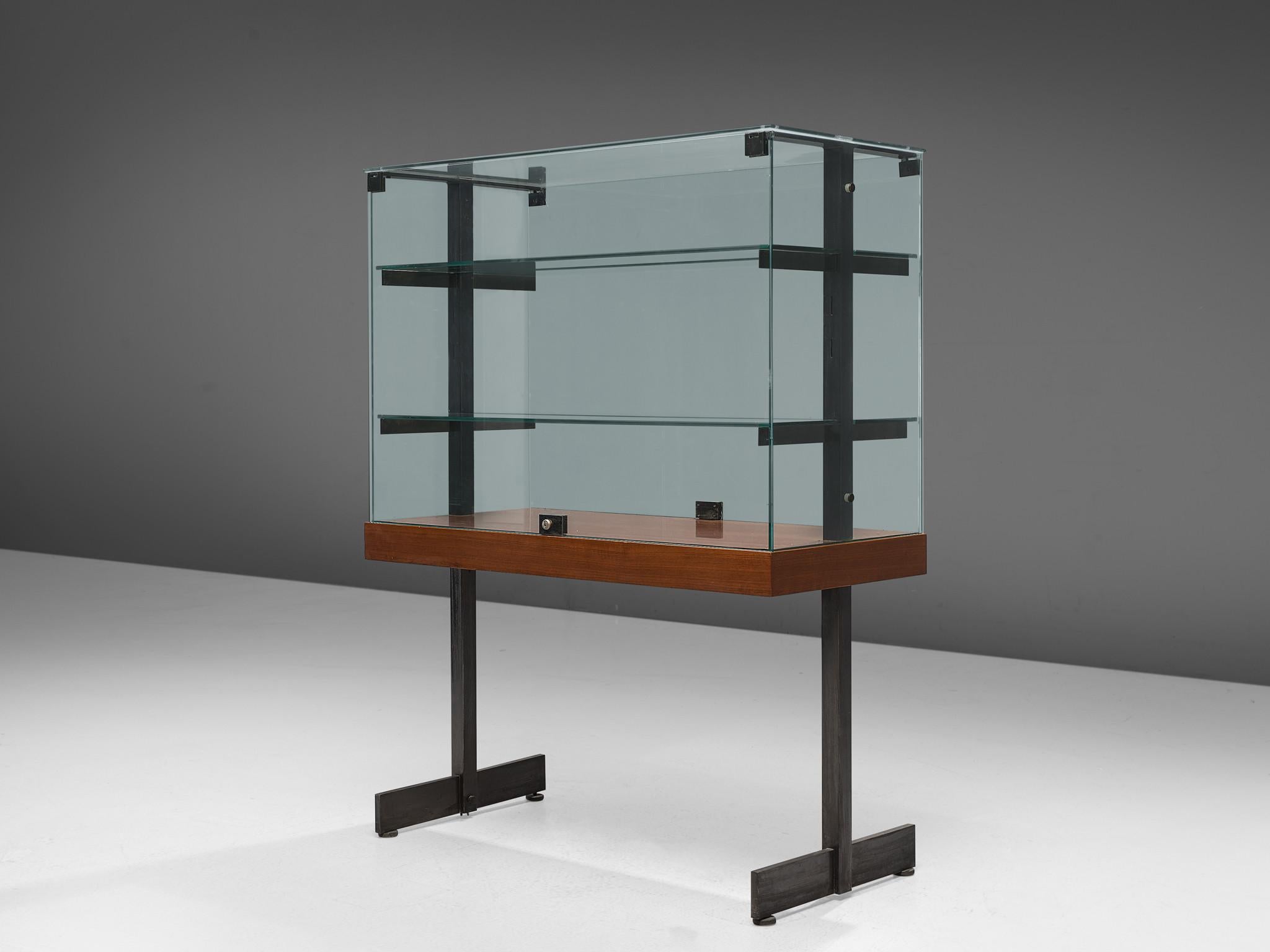 De Coene, showcase, teak, steel, glass, Belgium, 1960s 

Modernist showcase with lockable doors, accompanied with a steel frame and wooden shelf. The vitrine features the Brutalist characteristics of De Coene. The showcase was originally designed