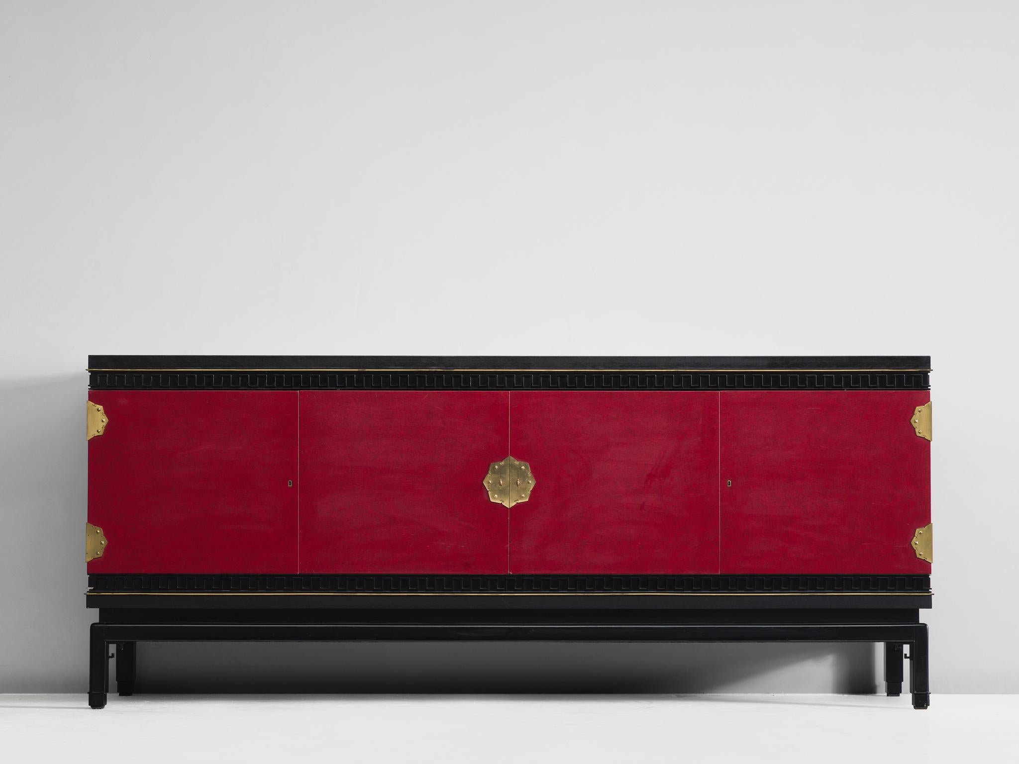 Sideboard, in oak, brass and skai, by De Coene, Belgium, 1960s. 

Rare early Art Deco style sideboard in oak and skai, signed by Belgian De Coene Frères. This credenza shows a beautiful deep red color with brass details. The detailing has hints of