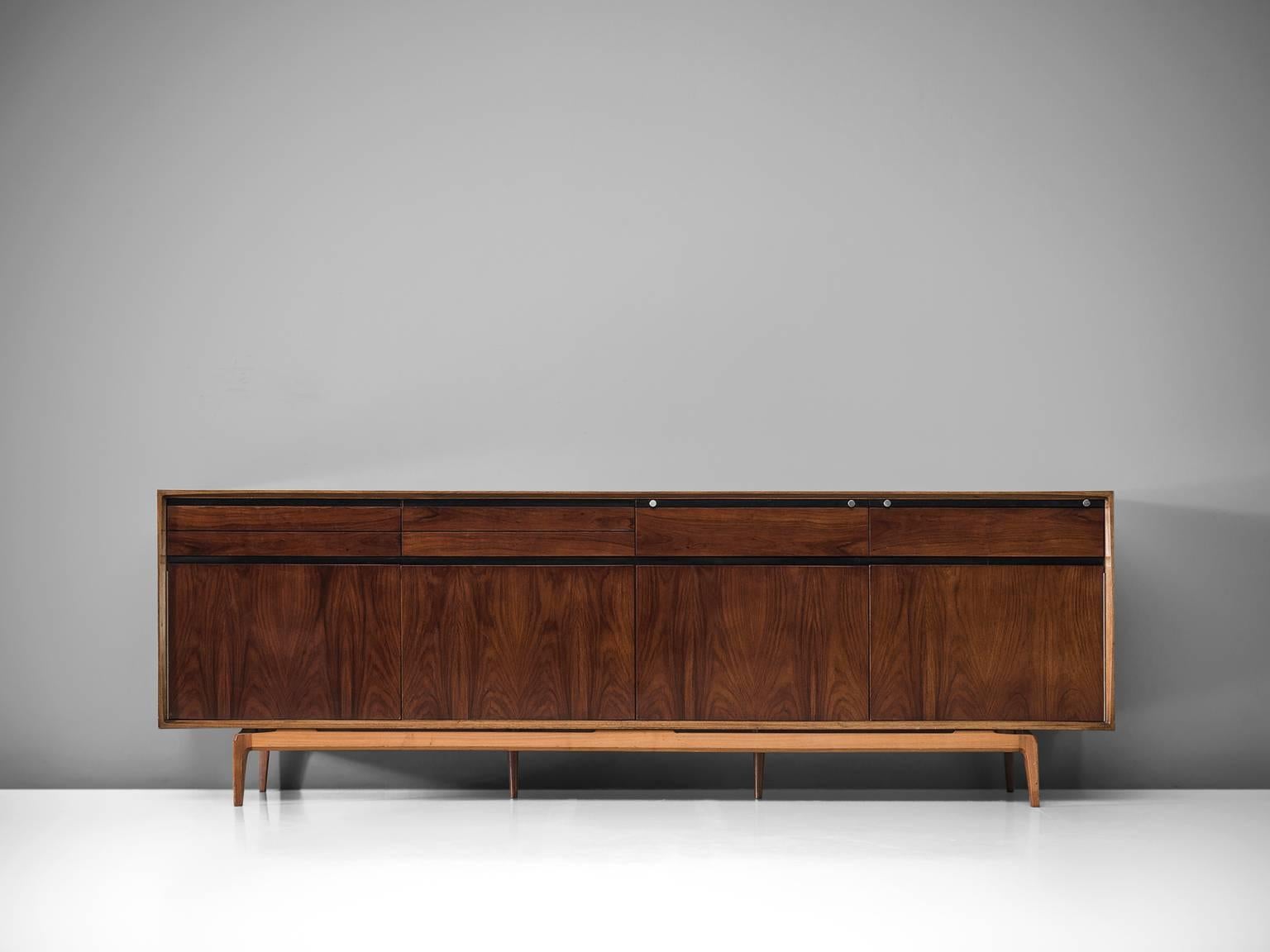 De Coene, sideboard, rosewood and walnut, Belgium, 1958.

This sideboard is well-constructed and detailed in a discrete manner. Produced in rosewood and walnut. The piece shows well-designed lines and interesting details, such as the folding