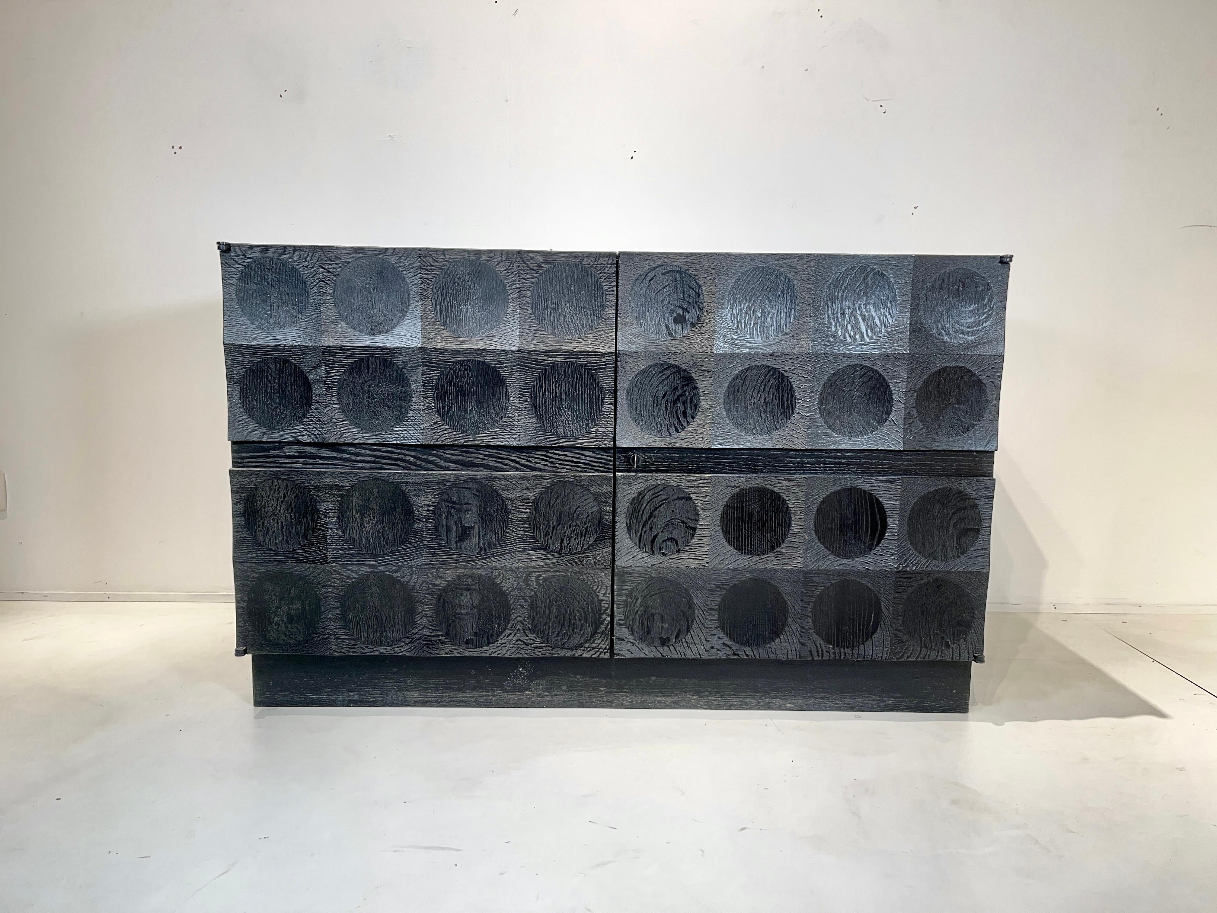 De Coene black oak painted cabinet, made in Belgium in the 1970s. Brutalist small sideboards included bar. More famous are his similar designs with a diamond pattern or a wavy pattern. Included key and in excellent original condition.