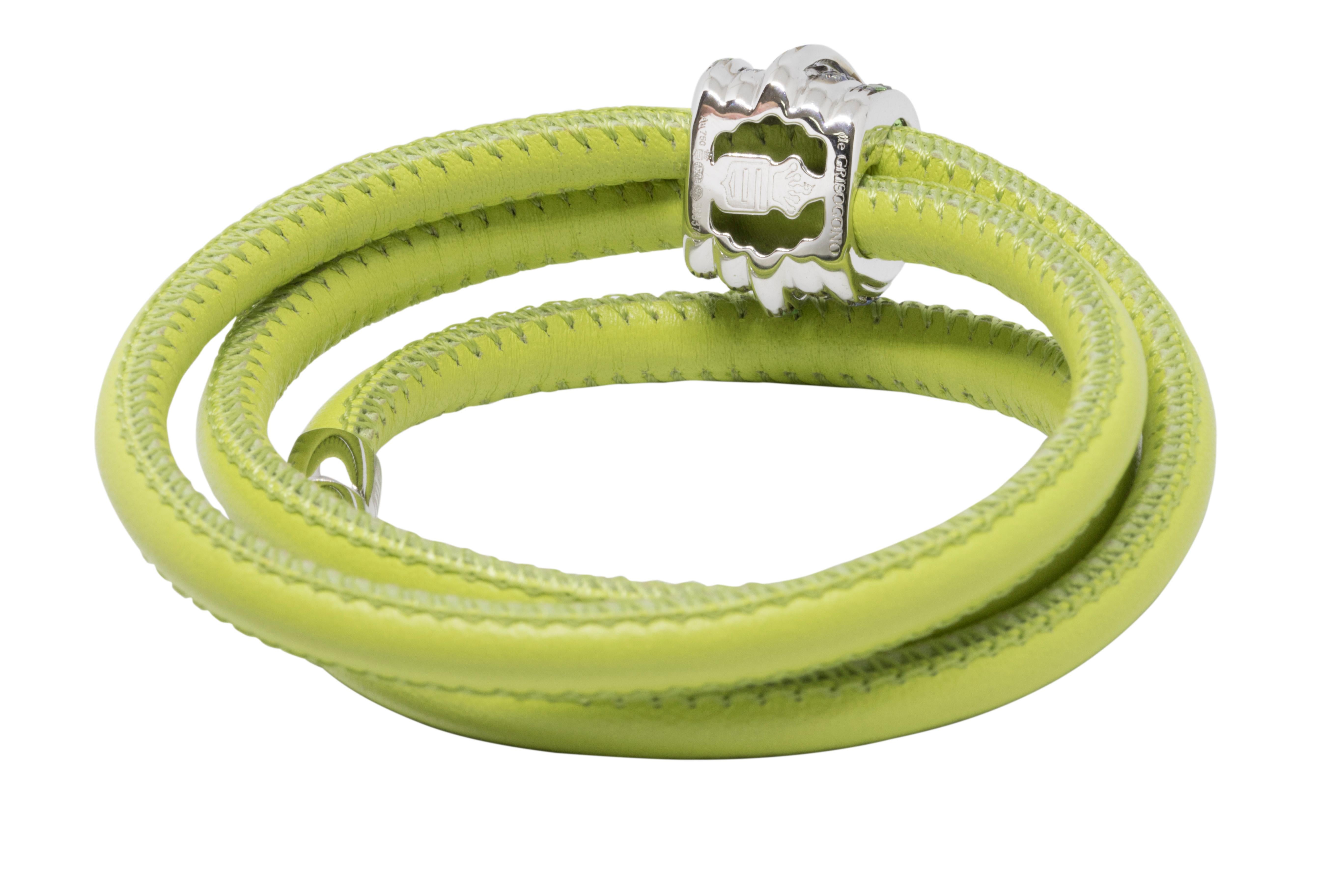 Parrot green calf leather 18kt white gold and tsavorites and blue sapphires Allegra bracelet from de Grisogono featuring a wrap-around silhouette

•	White gold 9.50 gr 
•	38 tsavorites- 0.70 gr 
•	41 blue pastel sapphires- 0.75 ct 
•	Leather cord-