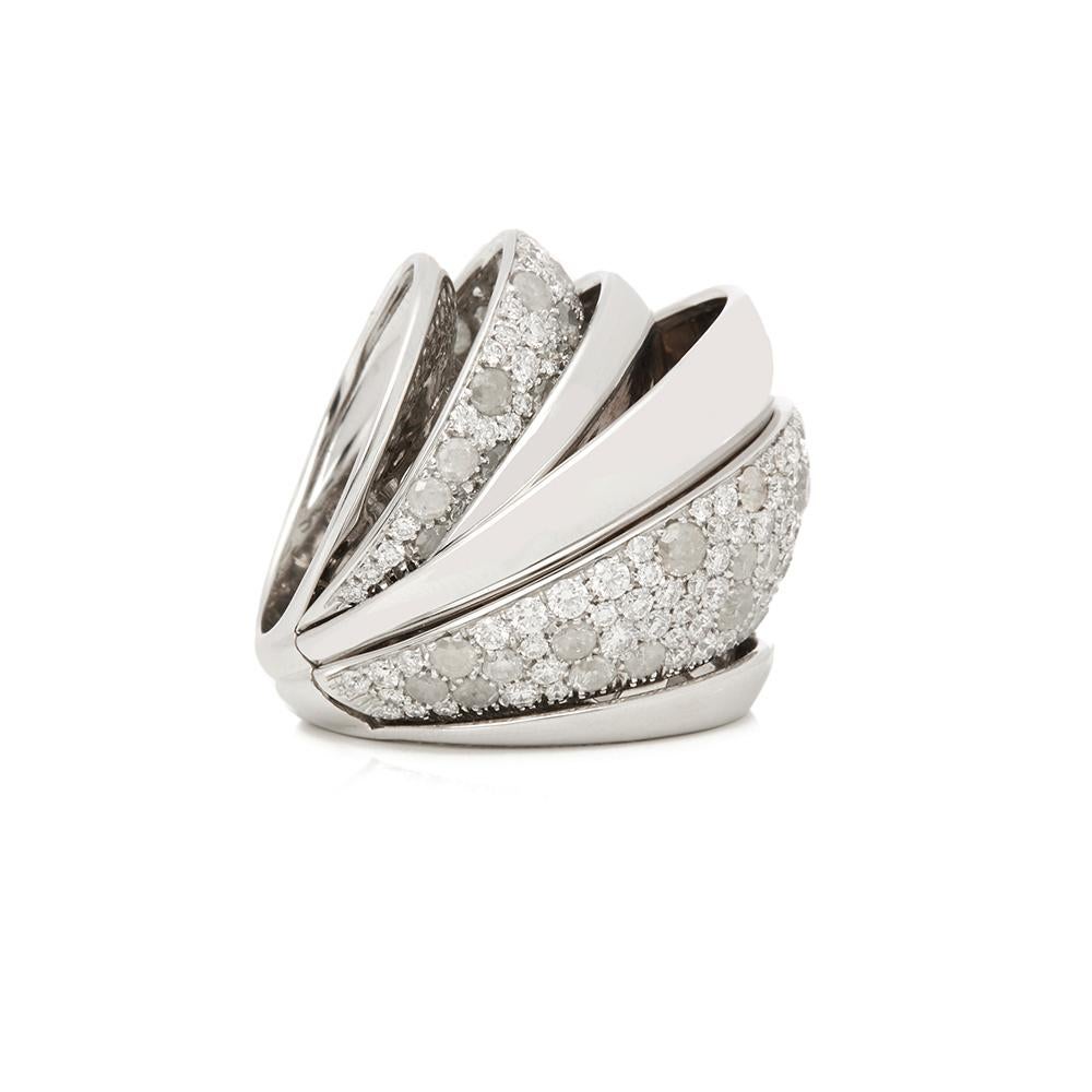 Code: COM2006
Brand: De Grisogono
Description: 18k White Gold Icy Diamond Cocktail Jane Ring
Accompanied With: Box & Certificate
Gender: Ladies
UK Ring Size: L 
EU Ring Size: 52
US Ring Size: 5 3/4
Resizing Possible?: NO
Band Width: 6mm
Condition: