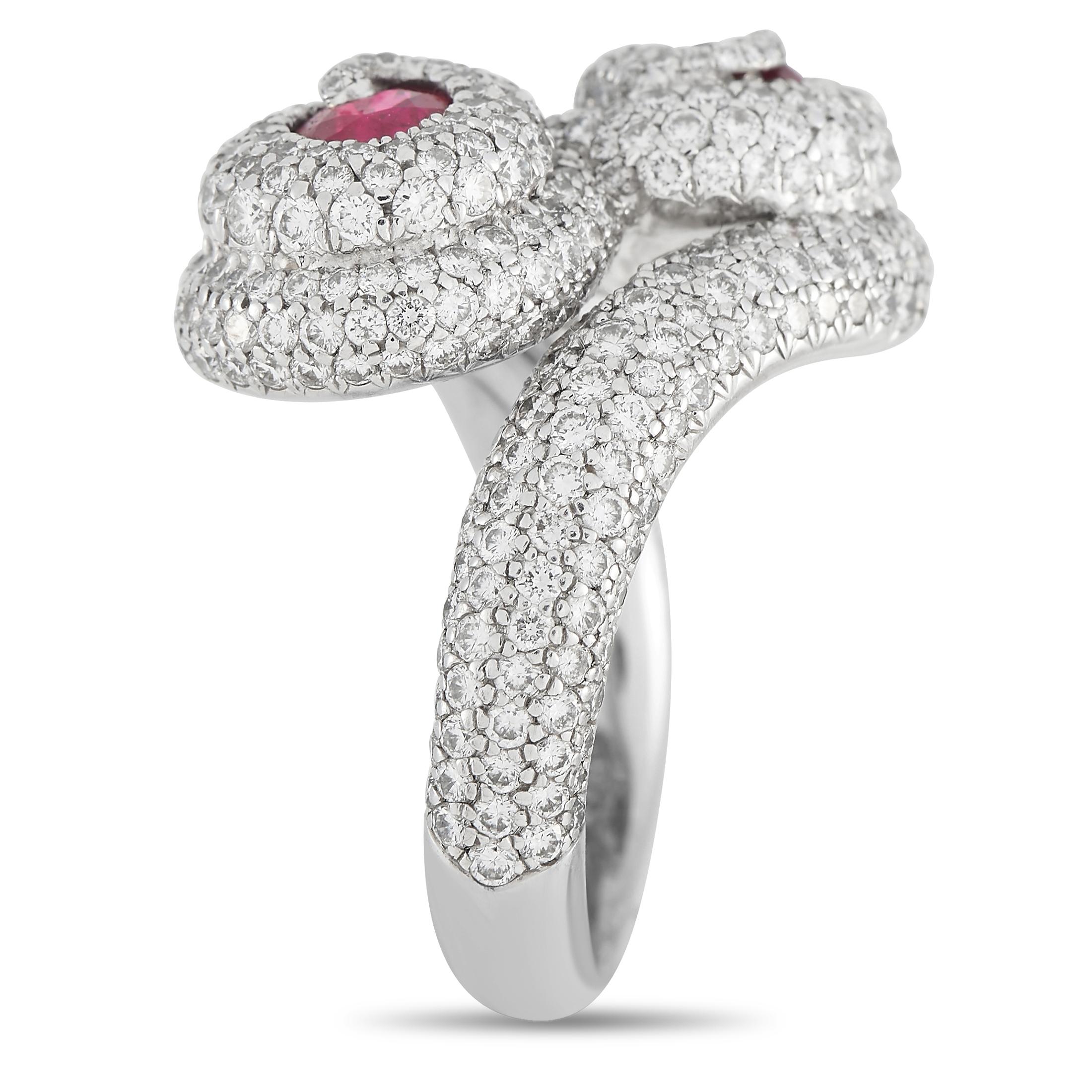 This De Grisogono ring will continually catch the light. Diamonds totaling 3.51 carats sparkle and shine from their place within the 18K White Gold setting, which features a 3mm wide band and an 8mm top height. A pair of rubies totaling 1.26 carats