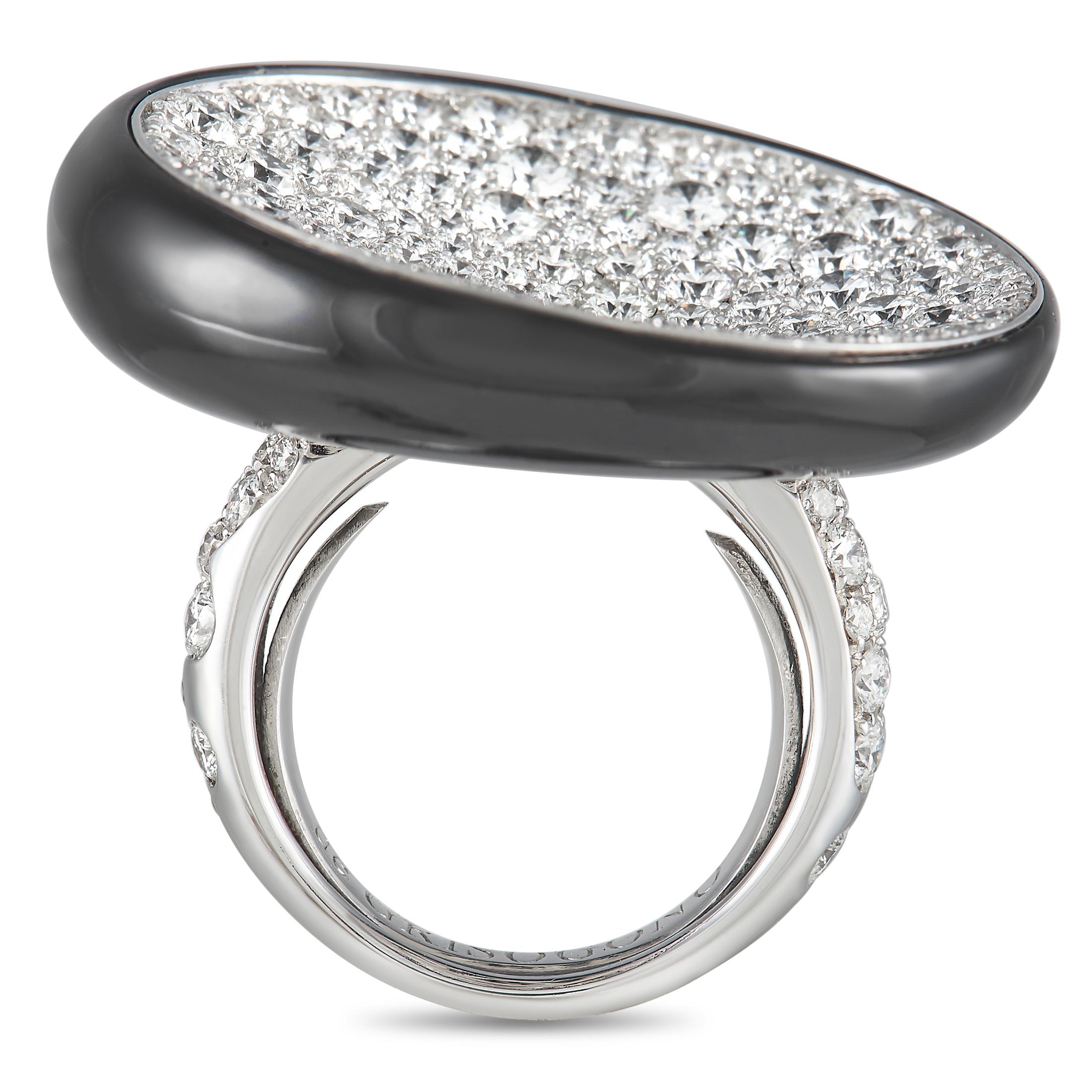 A glittering finger accessory with a truly bold personality. This diamond and onyx piece from de Grisogono features a 5mm band in 18K white gold. The shank's shoulders are traced with diamonds. Taking centerstage is an oversized black onyx in