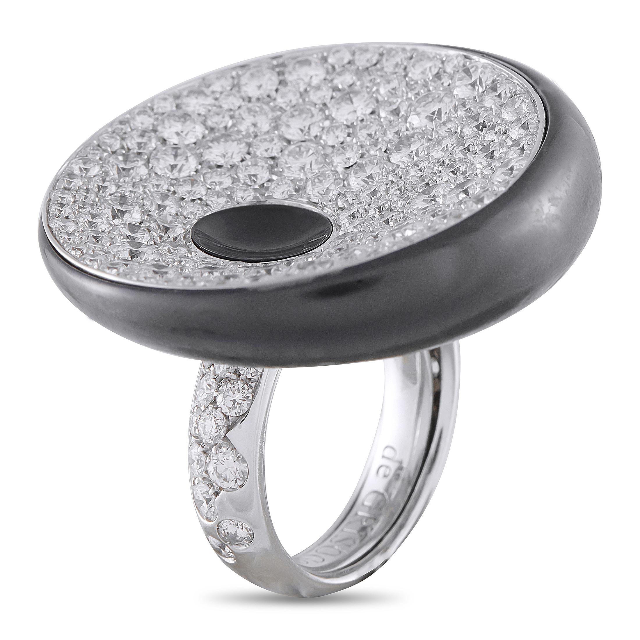 For maximalist glamour. This de Grisogono statement ring is crafted in lustrous 18K white gold, with a diamond-traced band leading up to the remarkable centerpiece. A bold, oversized onyx disc rests atop the band, purposefully tilted to capture