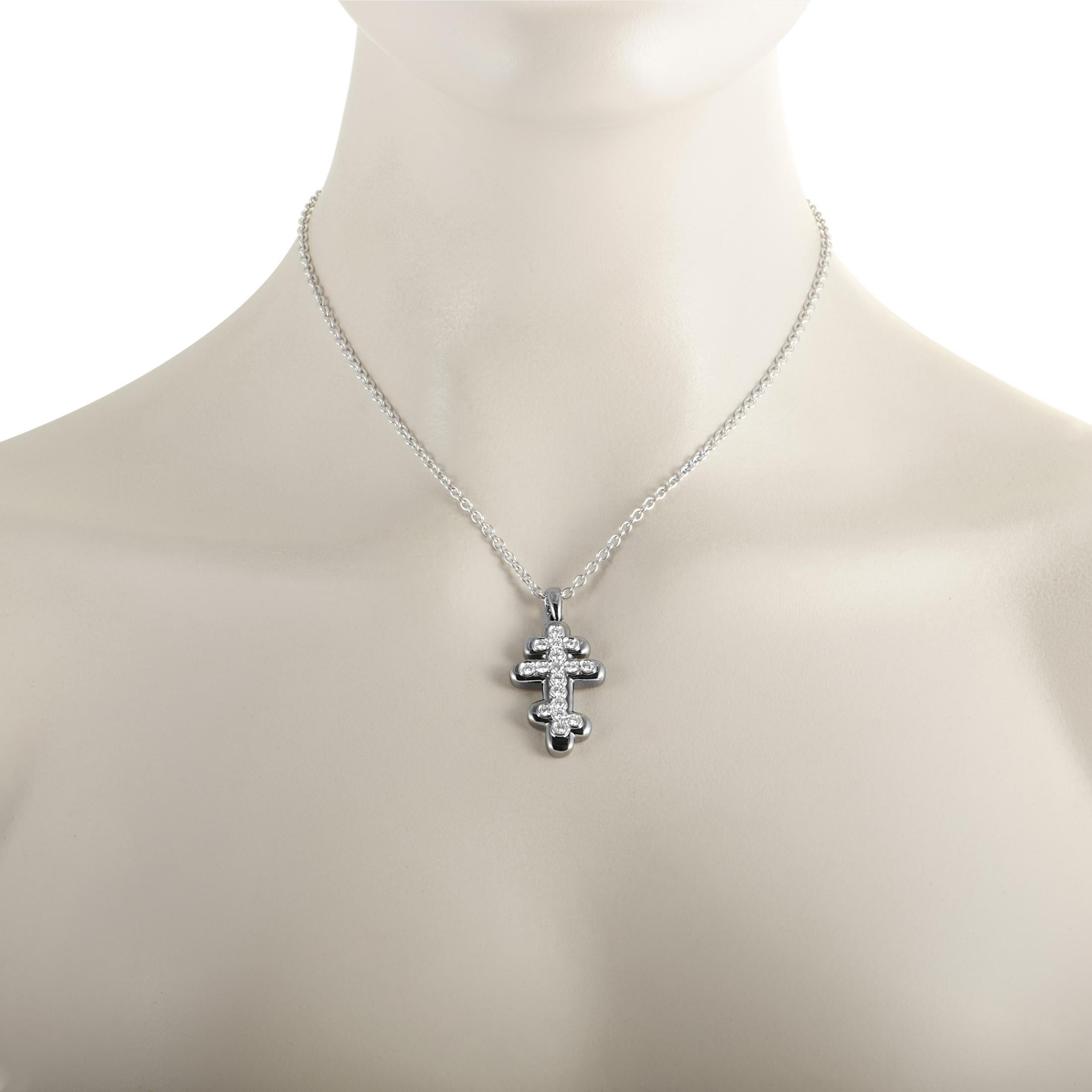 This de Grisogono necklace is made of 18K white gold and weighs 19.78 grams, boasting a 16.00” chain with lobster claw closure and a pendant that measures 1.62” in length and 0.87” in width. The necklace is set with diamonds that amount to 1.35