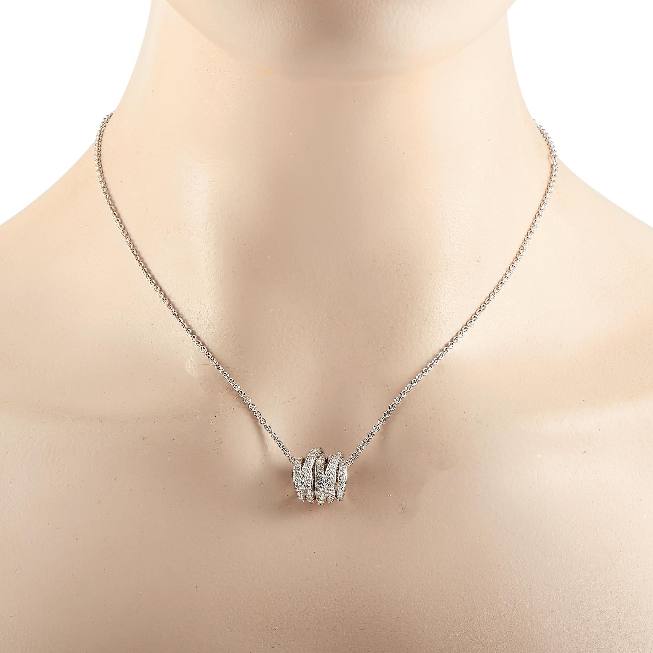 The de Grisogono “Allegra” necklace is made of 18K white gold and embellished with 79 white diamonds that amount to 1.10 carats. The necklace weighs 11.1 grams and boasts a 17” chain and a pendant that measures 0.55” in length and 0.55” in width.
 
