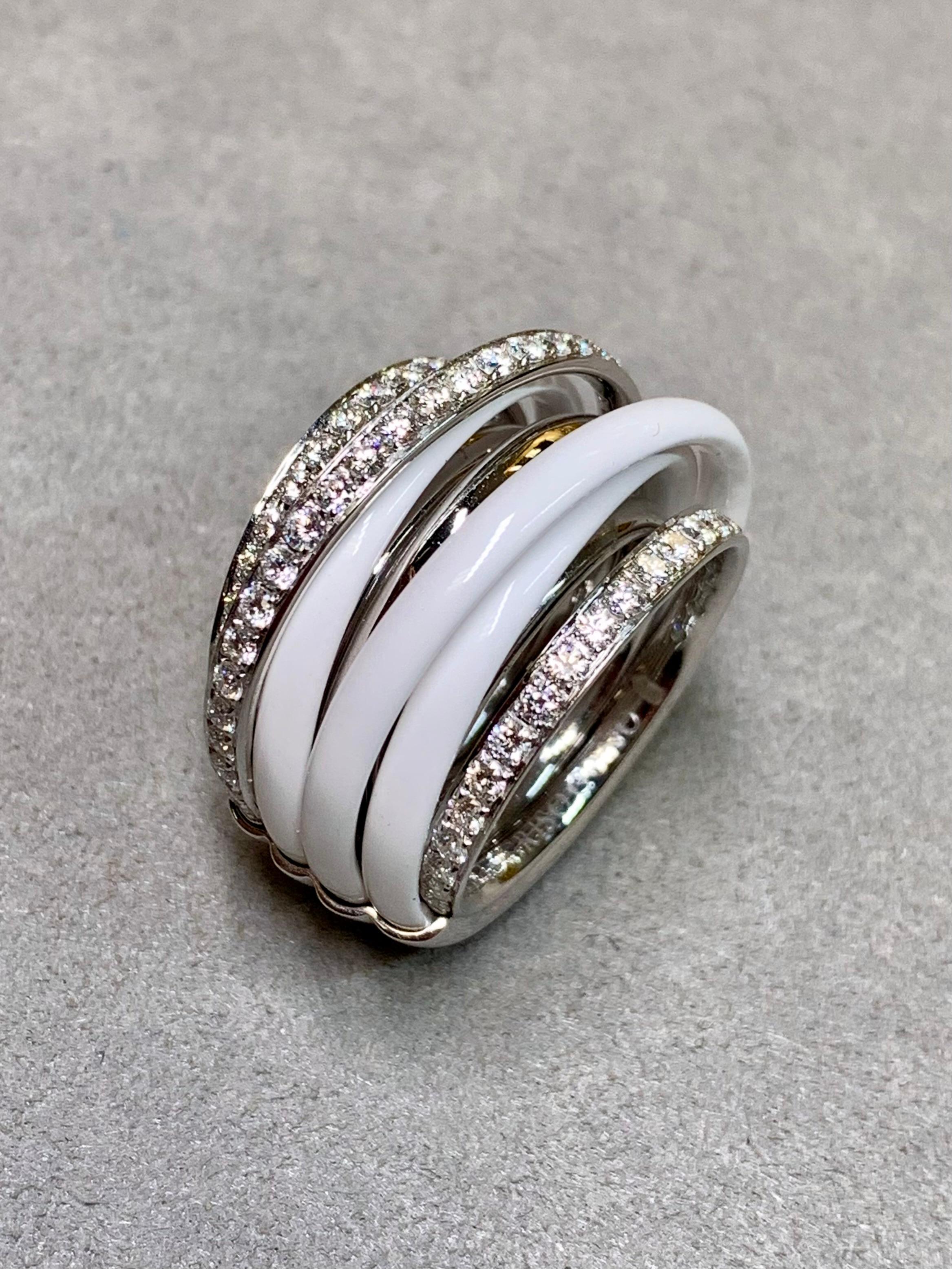 A fabulous cocktail ring by now extinct Italian maker, de Grisogono. Hand crafted in heavy 18K white gold and white ceramic, this impressive and substantial piece has been set with approximately 1.75ctw in F-G color Vs1+ clarity
