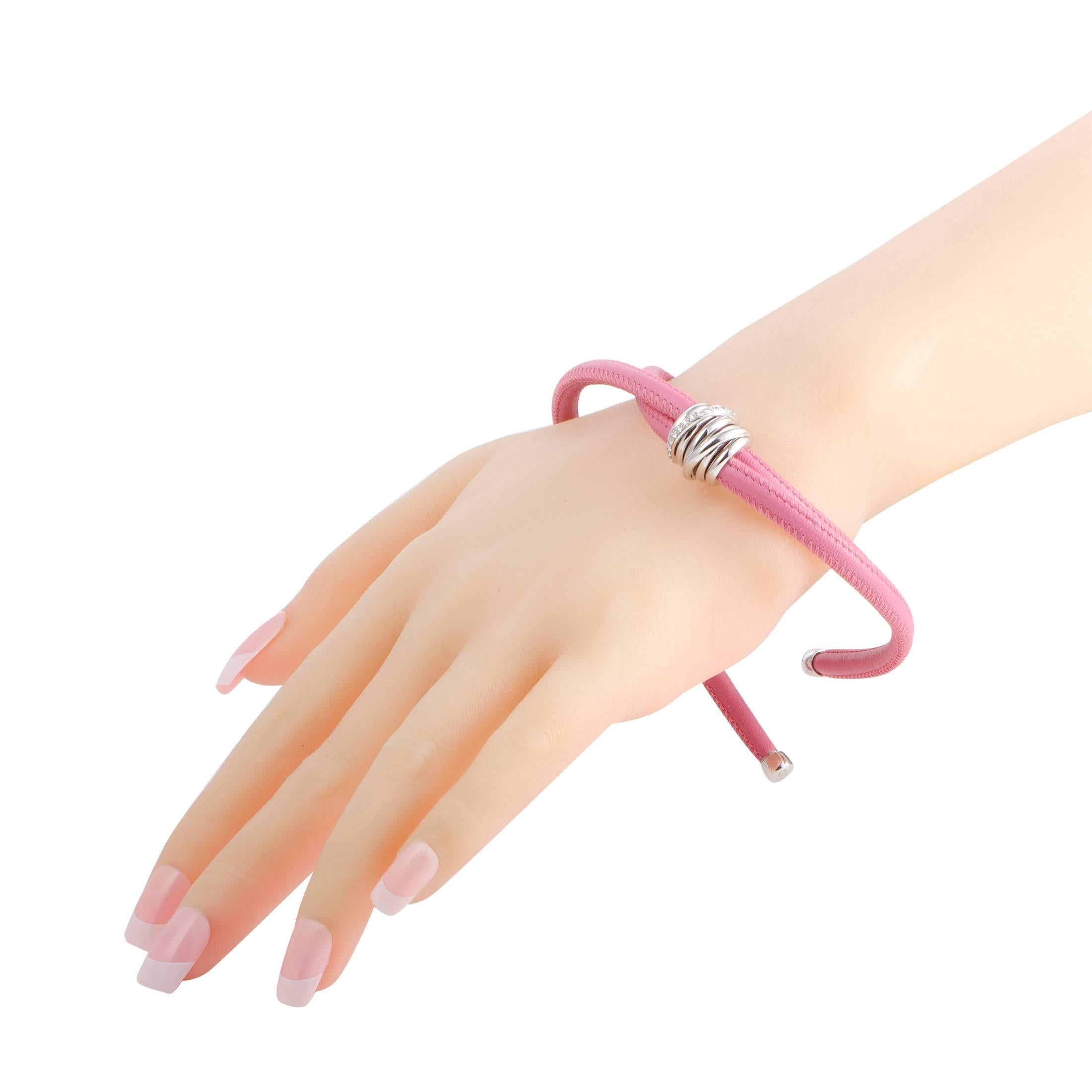 Gorgeously vivacious and feminine, this lovely bracelet is presented in eye-catching pink leather and gleaming 18K white gold and given a nifty touch of luxurious brilliance by the scintillating diamond stones. The bracelet is created by de