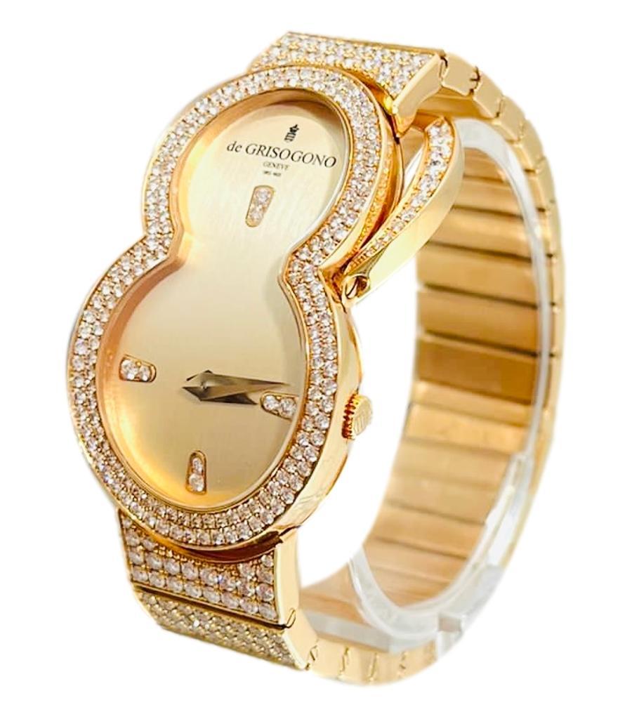 
Rare Item - De Grisogono 'Be Eight' 18k Rose Gold & Diamond Watch

Solid heavy 18k gold watch with champagne gold face and diamond set hour markers.

Set with 186 brilliant white diamonds totaling 10.31cts.

Fancy hinged stand, set to the face of