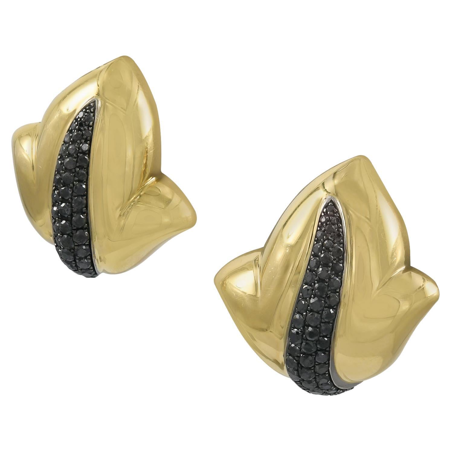 A pair of gold ear clips made in 18K yellow gold; set with 101 round brilliant-cut black diamonds, weighing a total of approximately 1.63 carats.
Measurements: 7/8 x 7/8 inch. 
Gross weight: 19.50 g.
Retail: $16,400
Signed: de GRISOGONO; numbered