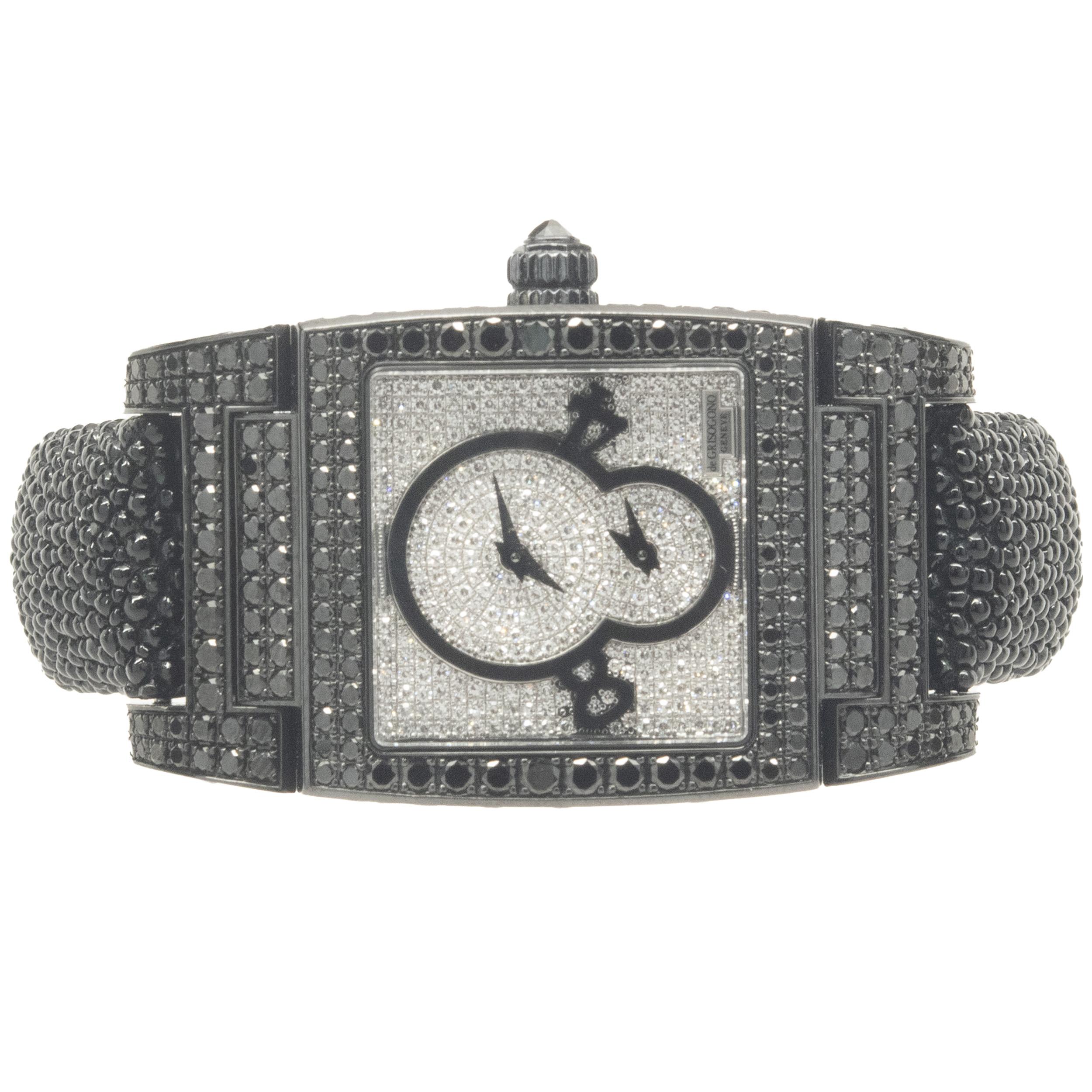 De Grisogono Black Stainless Steel Black and White Diamond UNO

Movement: automatic
Function: hours, minutes, seconds
Case: 43 x 29mm rectangular black stainless steel pave diamond case, sapphire crystal, push/pull crown
Dial: pave diamond
Bracelet: