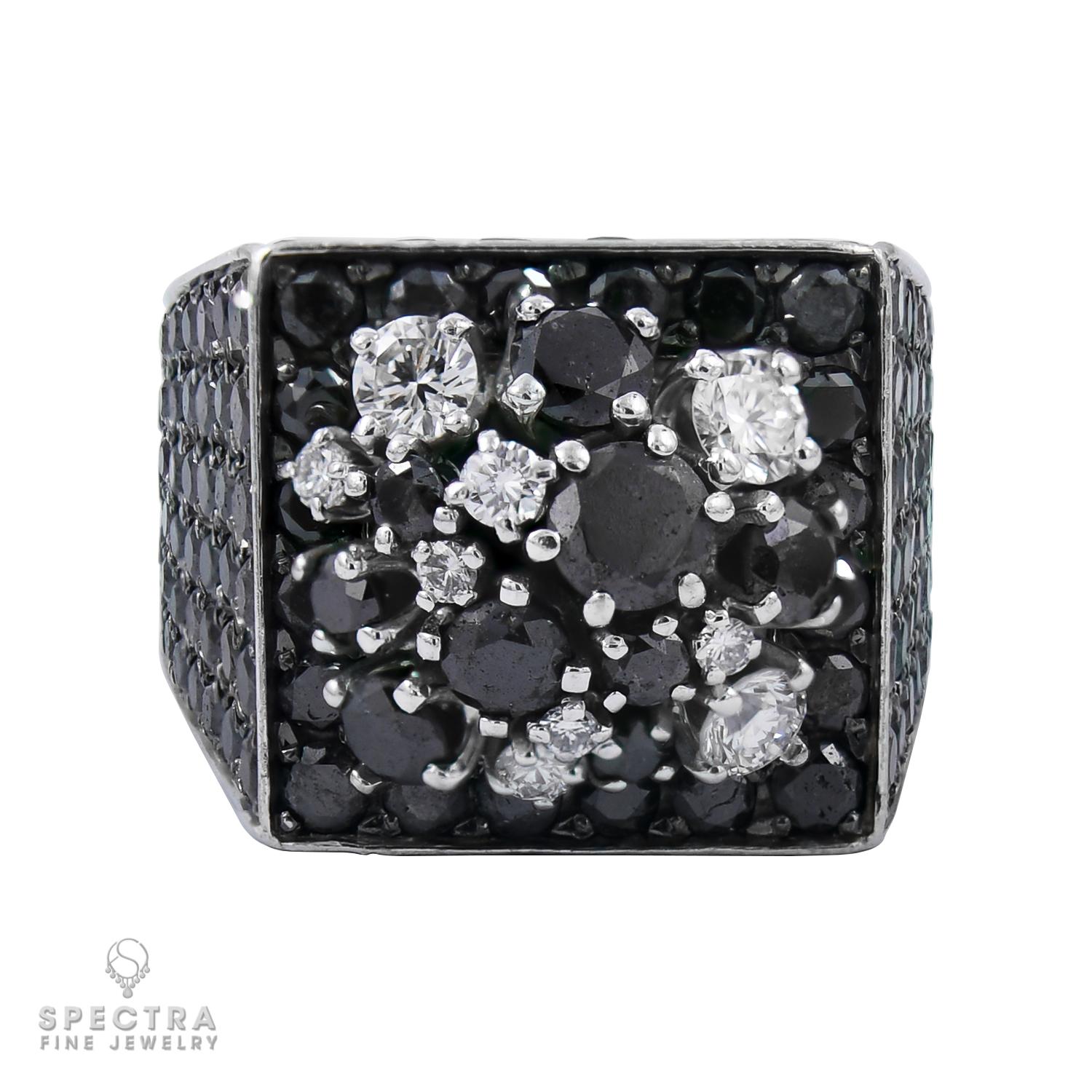 A chic cocktail ring set with round black diamonds, weighing a total of approximately 11.27 carats, crafted in 18k white gold. The ring's top measures 11/16 x 11/16 inch.
Size 6.25 (EU 52).
Gross weight: 29.50 grams.
Signed: de GRISOGONO.
Numbered: