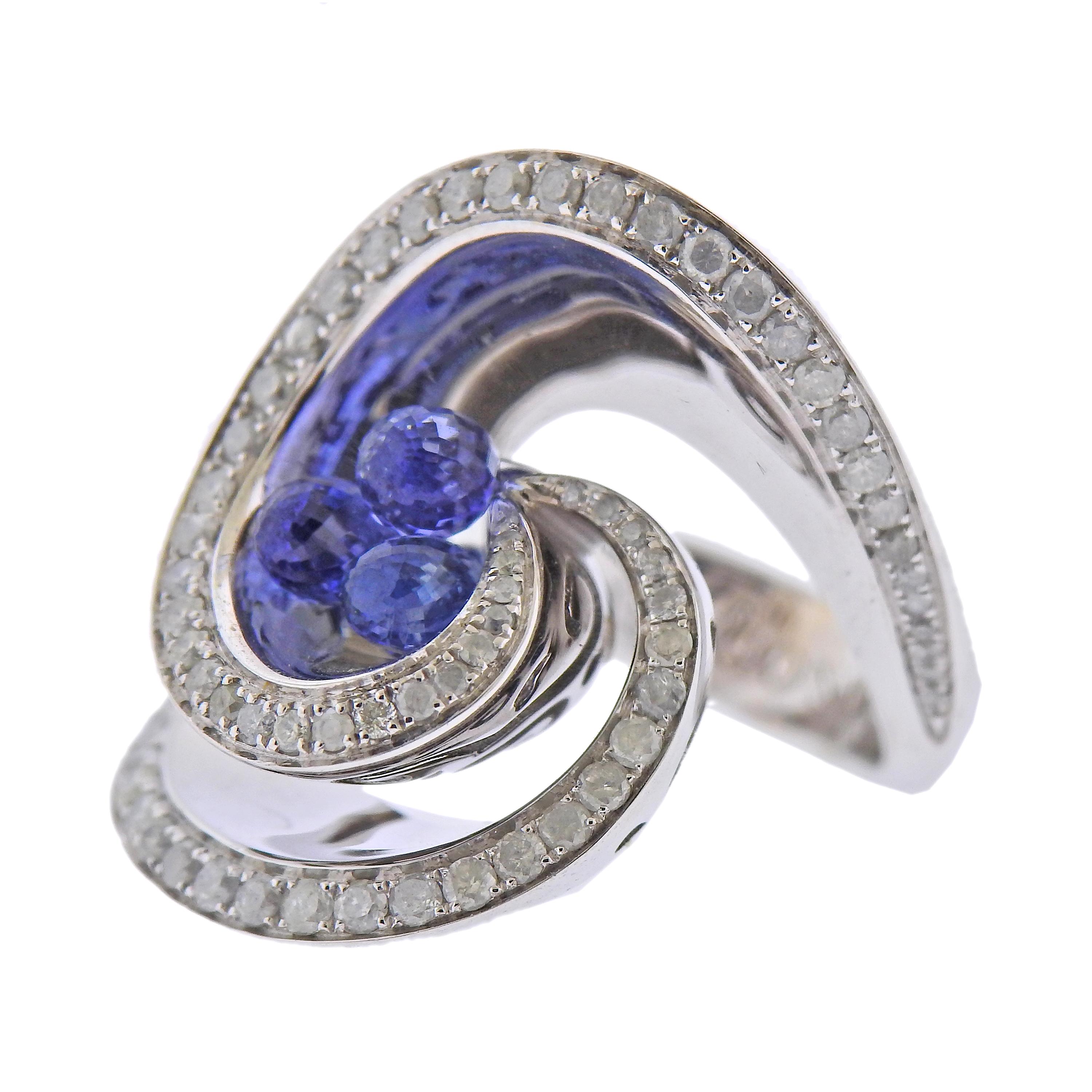 Brand new 18k white gold Chiocciolina ring by De Grisogono, set with 1.03ctw in icy diamonds, and 1.50ctw in sapphire briolettes. Ring size - 5.5 (50), ring top - 25mm wide. Marked - de Grisogono, Au750, B67030. Weight- 16.8 grams. Ring comes with