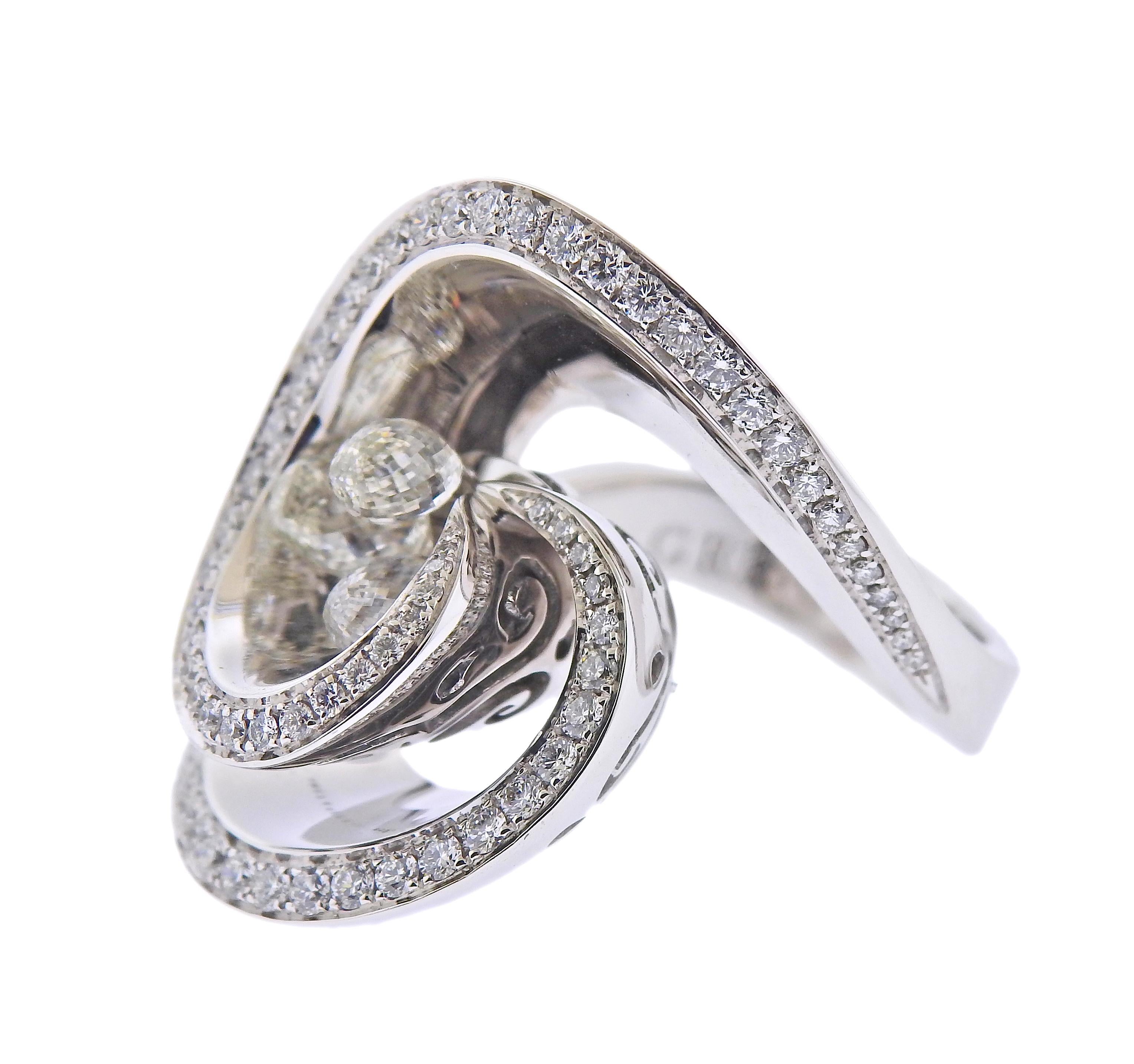 Brand new 18k white gold ring by De Grisogono. Set with a total of 2.35ctw VVS F/G diamonds, three briolette cuts are 1.50ctw, & round diamonds are 0.85ctw. Ring size - 7 1/4 (55) , ring top - 25mm wide. Marked - de Grisogono, Au750, serial number.