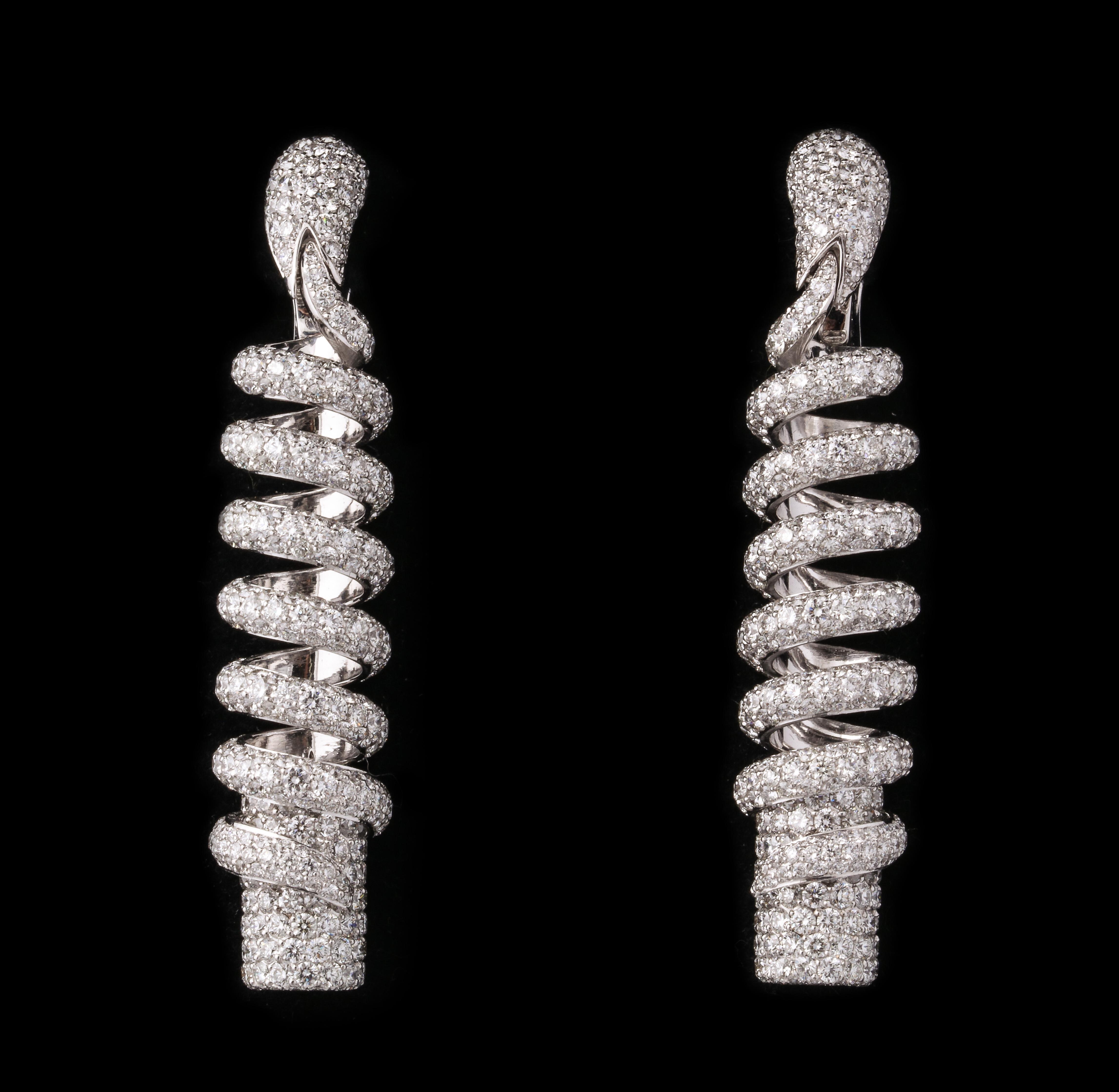 de Grisogono Diamond Pave White Gold snake earrings. 46 grams. Marked 750 de Grisogono.  Approximately 10 cts of fine white full cut diamonds.  2 3/4 inches long and 1/2