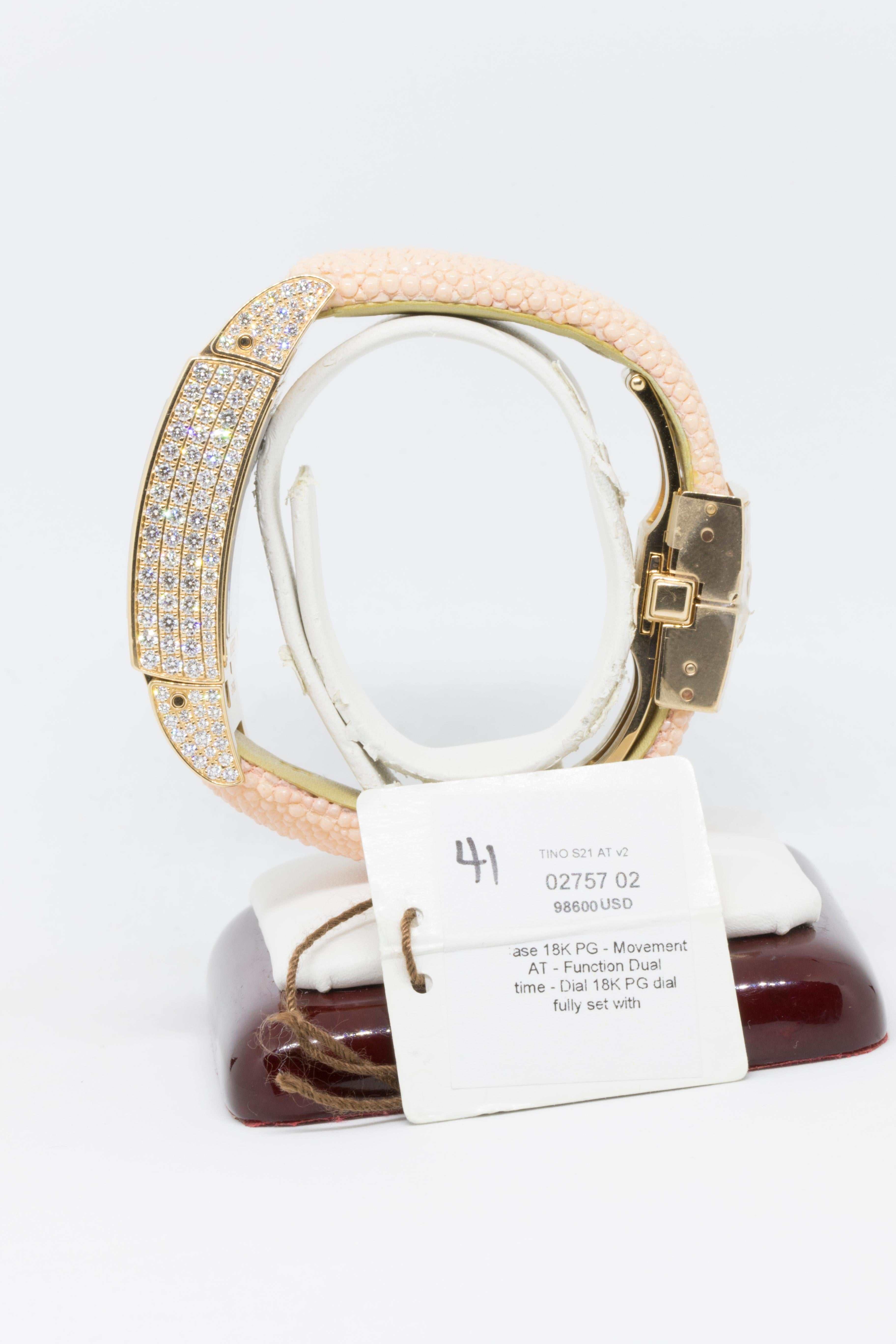 Specifications:
Bezel: 18K Rose Gold Diamond
Case Back: Transparent (See-Through)
Case Size: 33.95×49.2
Condition: Unworn
Dial Color: Diamond Pave	
Crown: Pull Out
Gender: Ladies
Watch & Function: Hours Minutes Second & Time Zone
Lug Material: 18K