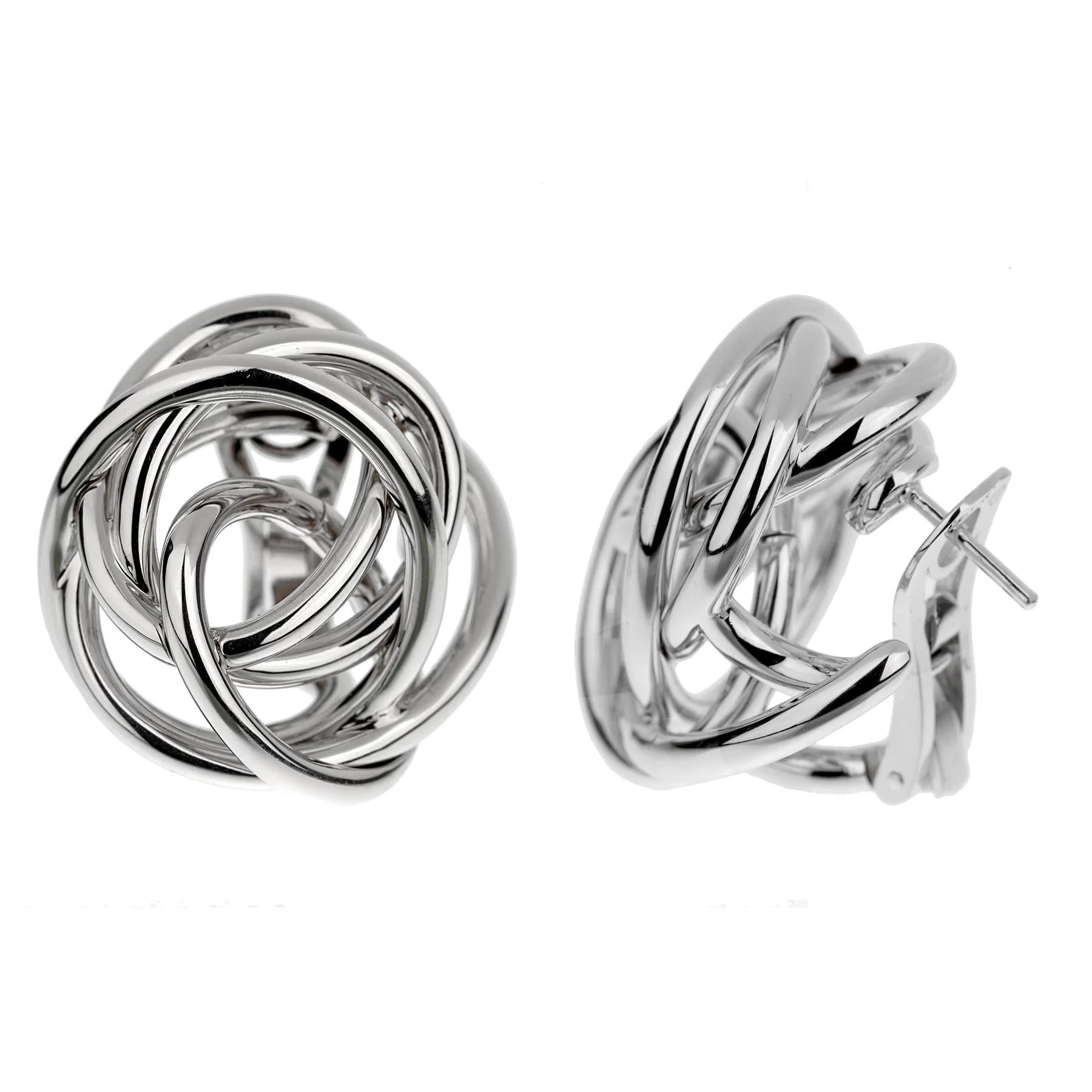 Each earring is composed of bold interlaced strands of white gold, meticulously crafted to create a sense of fluidity and movement. The woven design evokes a sense of refined sophistication, making these earrings a versatile and timeless addition to