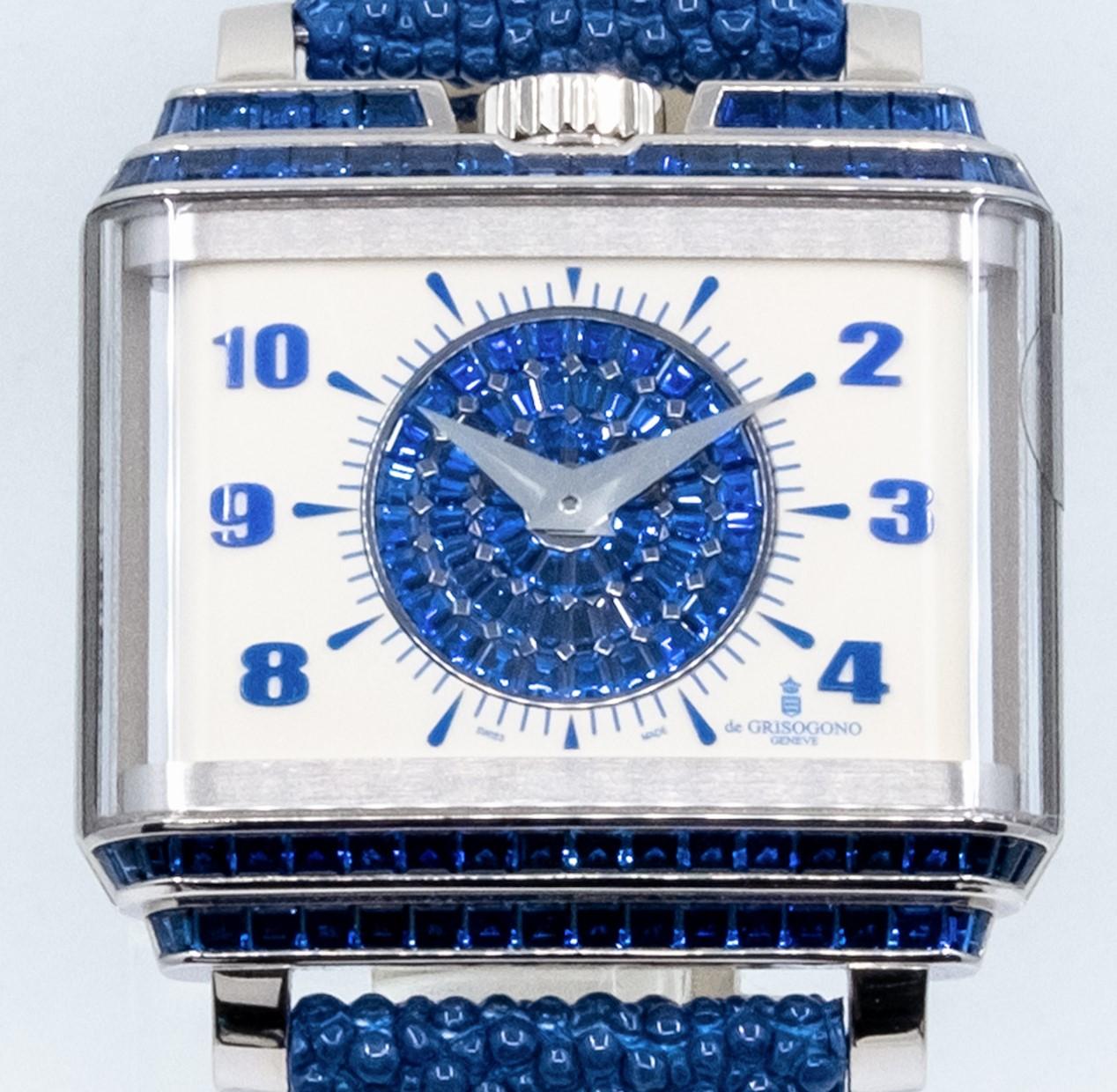 de GRISOGONO New Retro W S24S
•	Baguette Cut Blue Sapphires and Crown 12 o'clock Dial Set
•	Sapphire Crystal Case Back
•	Off White Dial Set with Baguette Cut Blue Sapphires