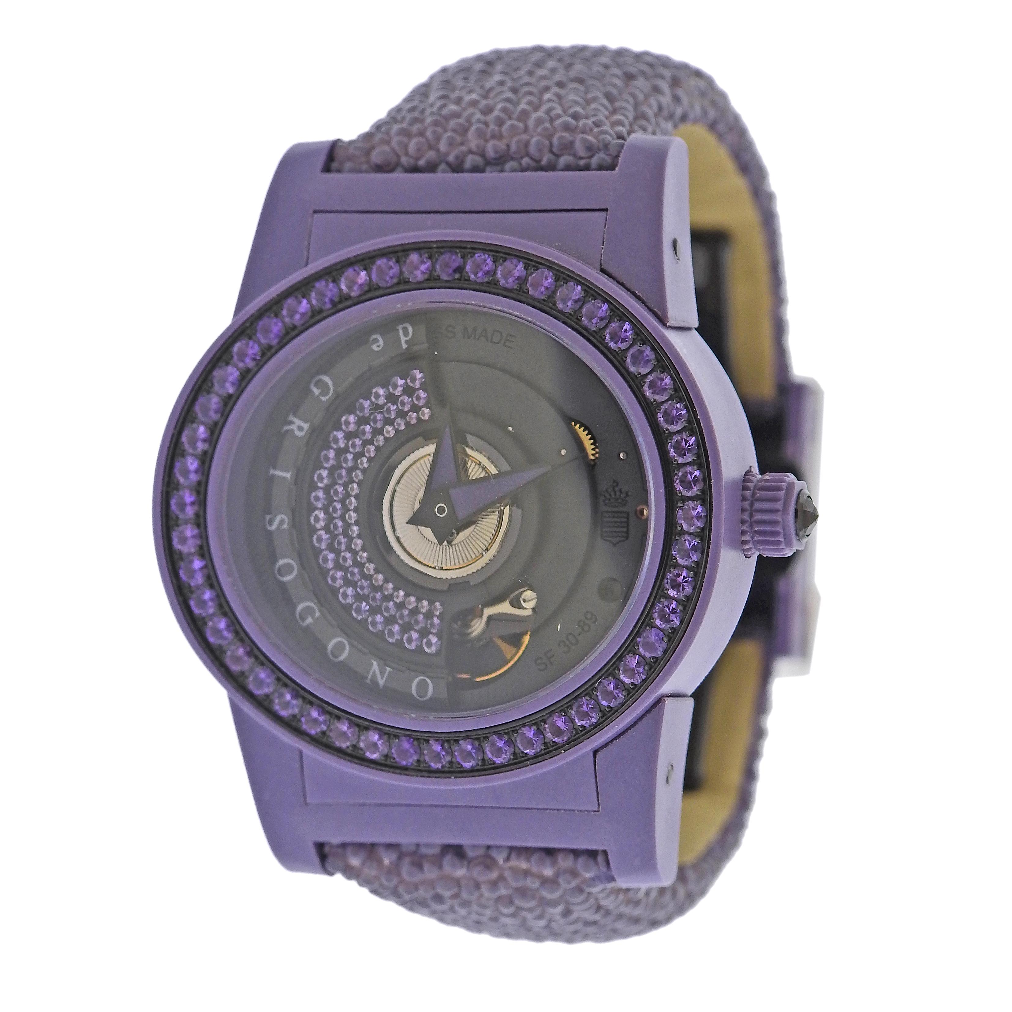 New with tag de Grisogono Tondo by Night watch, featuring violet purple fiberglass case, violet galuchat leather bracelet and deployant buckle. Case decorated with amethysts. Automatic movement. Comes with box and papers. Case - 38mm excl. crown x
