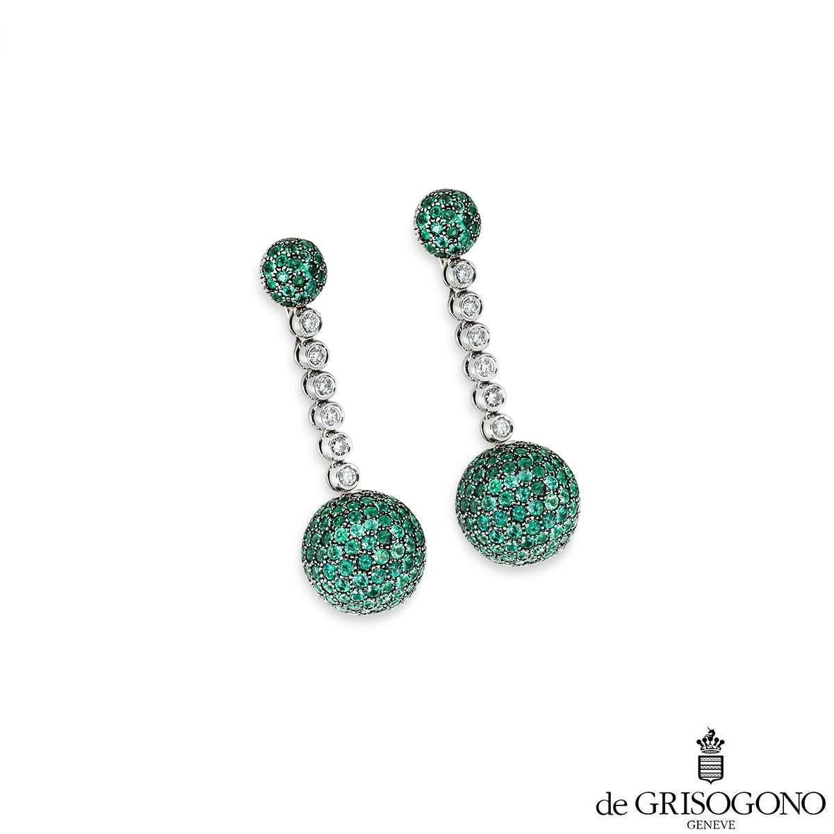 A pair of 18k white gold tsavorite and diamond drop earrings by De Grisogono, from the Boule collection. Starting with a dome design at the top pave set with vibrant tsavorite garnets, suspending 6 bezel set diamonds, with a total diamond weight of
