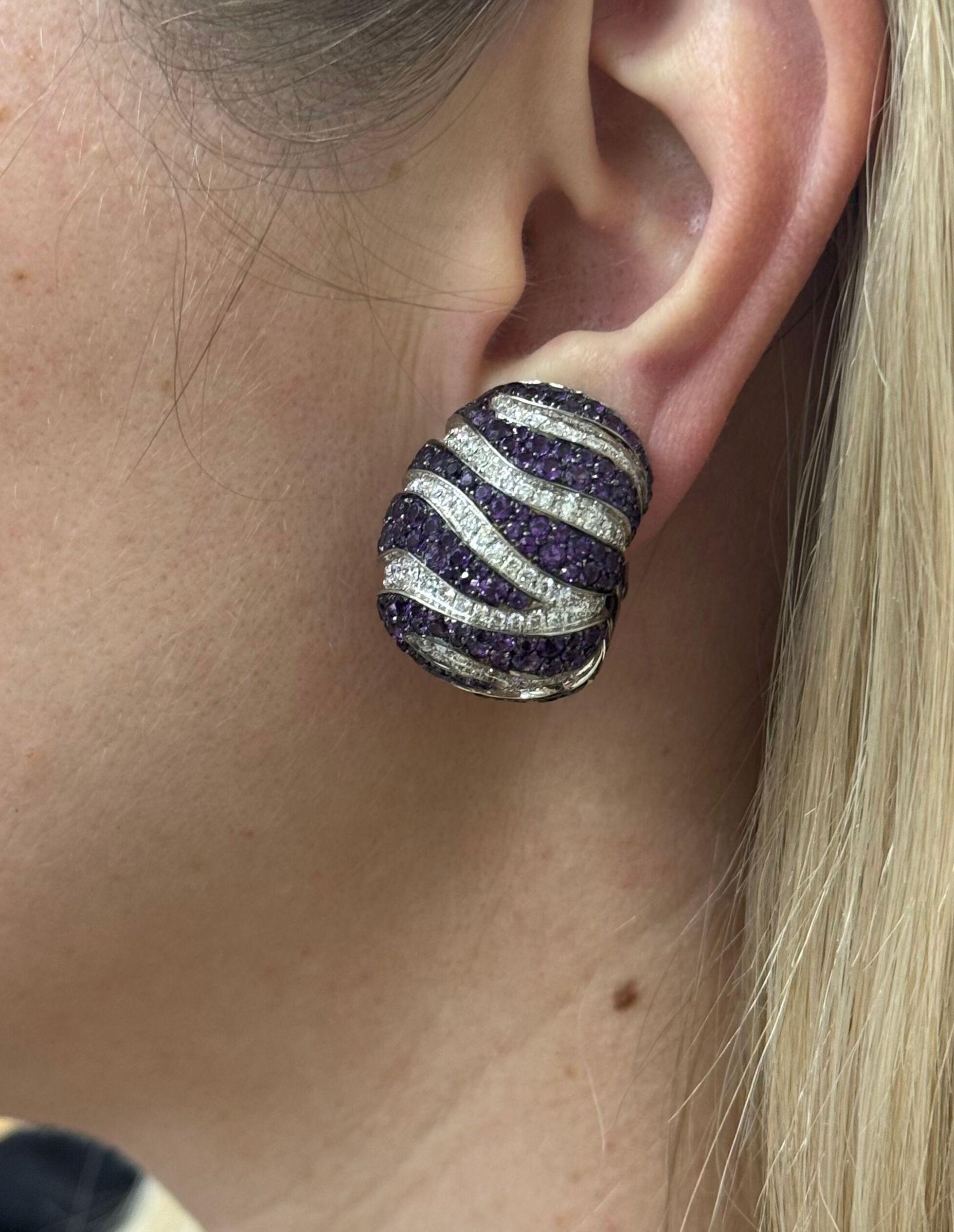 Pair of large and impressive Zebra earrings by de Grisogono, in 18k white gold, with amethyst and approx. 4.00ctw G/VS diamonds. The earrings have 5 missing amethysts. Earrings are 30mm x 23mm. Marked: de Grisogono, Geneve, B6657, B01394. Weight of