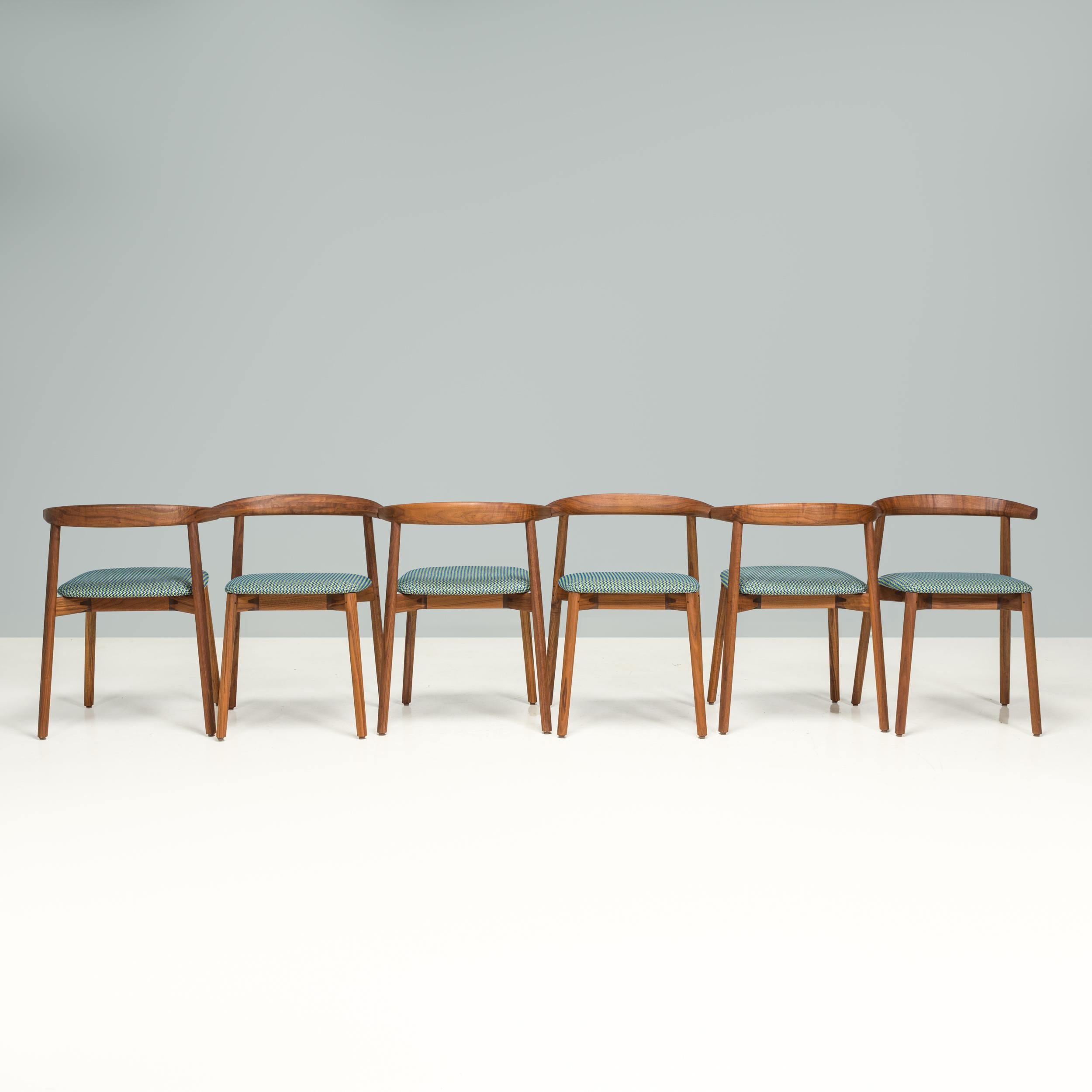 Designed and made by De La Espada in their factory in Portugal, the Ando dining chairs are a sleek, contemporary design.

Beautifully crafted, the chairs have a compact shape and are constructed from Danish oiled walnut.

With softly curved