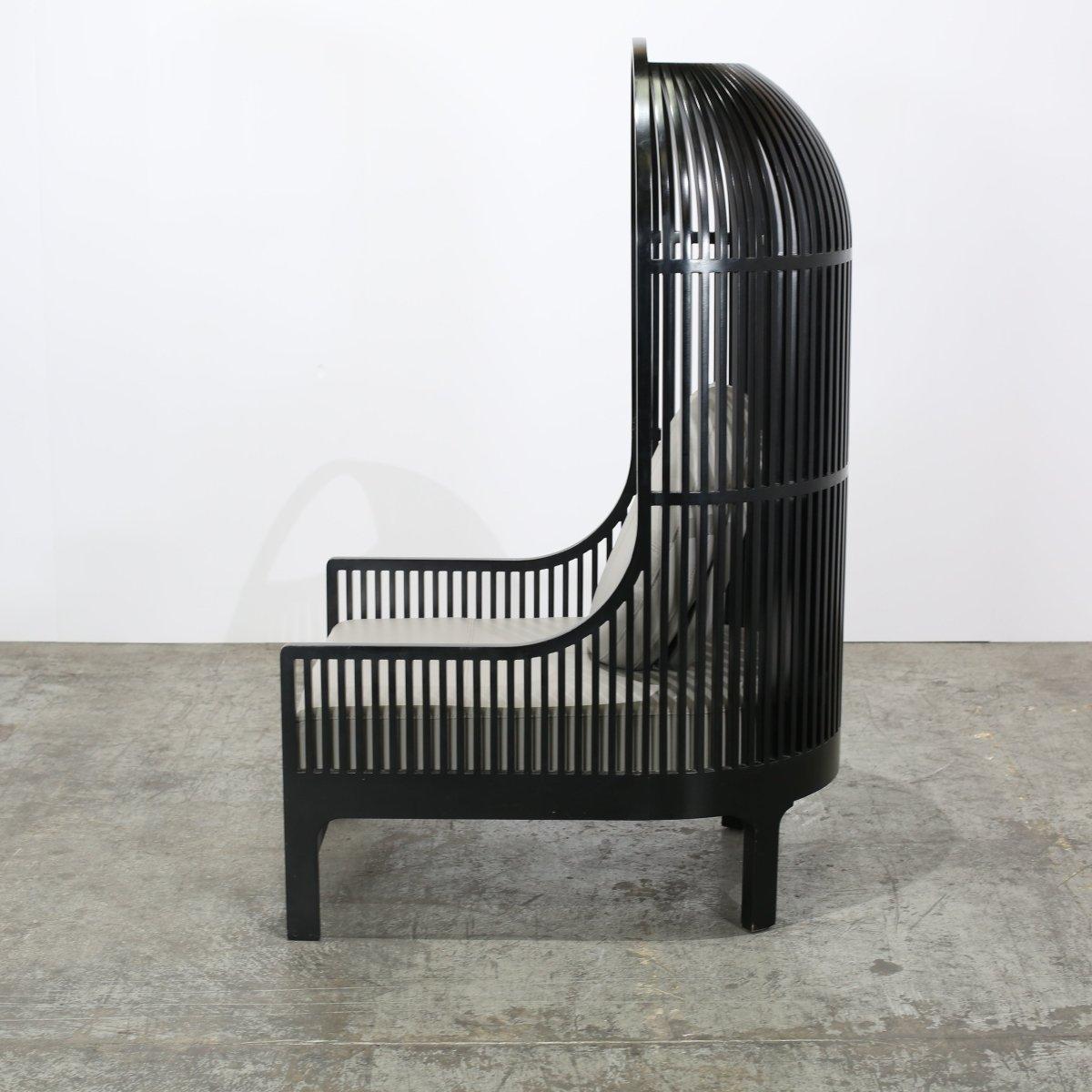 Introducing the Nest Chair by Autoban for De La Espada, a true masterpiece of luxury furniture. Crafted with great attention to detail, this chair exudes elegance and sophistication. The unique design features a curved backrest that mimics the shape