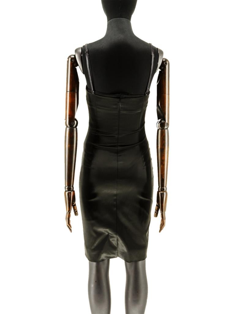 A late 1990’s Dolce & Gabbana black silk satin fitted stretch dress incorporating an inner bra, suspended on a pair of adjustable self and elasticated straps, finished with a back vent, fully lined in the iconic brown and beige leopard print lining.