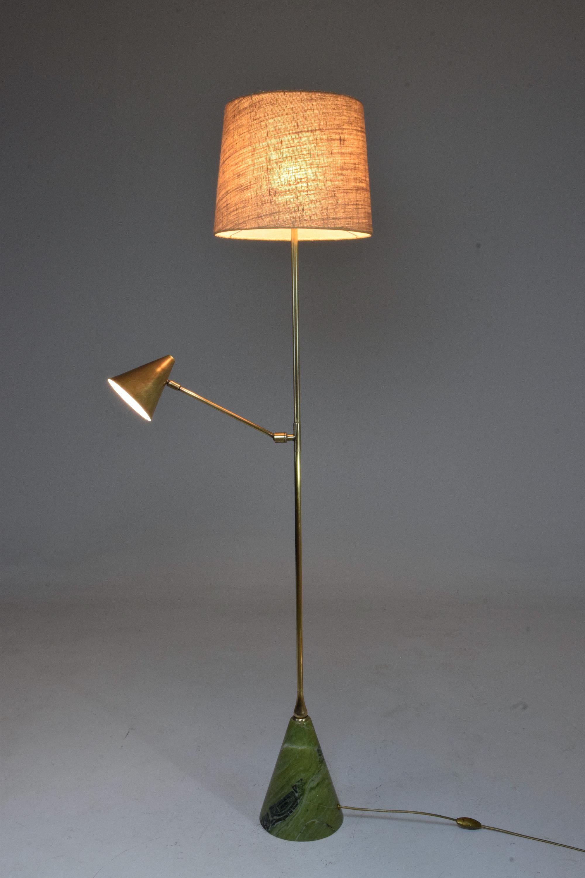 This floor lamp is designed with a reading light positioned mid-length which articulates a conical brass shade, so you can direct the light with ease. Both lighting systems work independently making it a functional addition to any living areas near