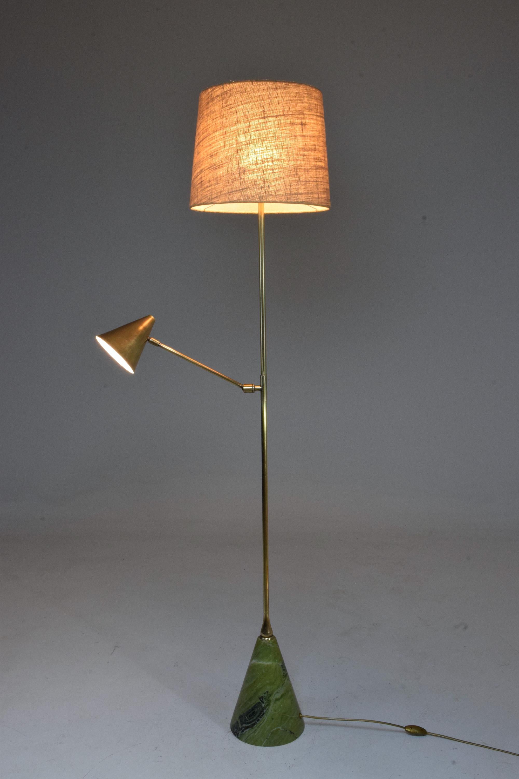 This bespoke contemporary floor lamp is designed with a reading light positioned mid-length which articulates a conical brass shade so that you can direct the light with ease. Both lighting systems work independently making it a functional addition