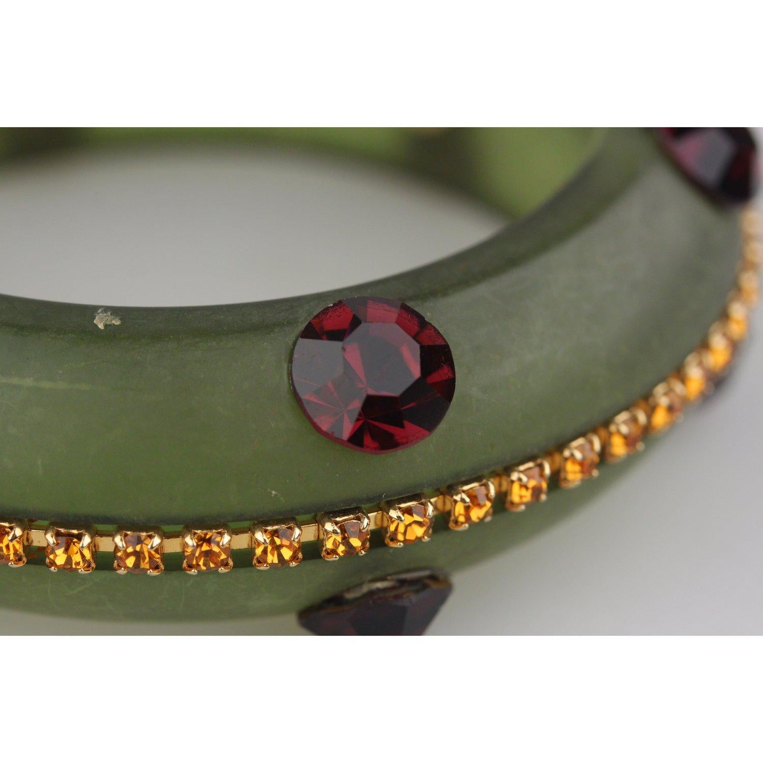Haute Couture Bracelet created by Gianni De Liguoro in green satin acrylic resin.  Beautiful decoration made of orange and purple crystals Bangle  design. De Liguoro signature metal tab intenally. Height:1 inch - 2,5 cm - Inner diameter: 2,6 inches